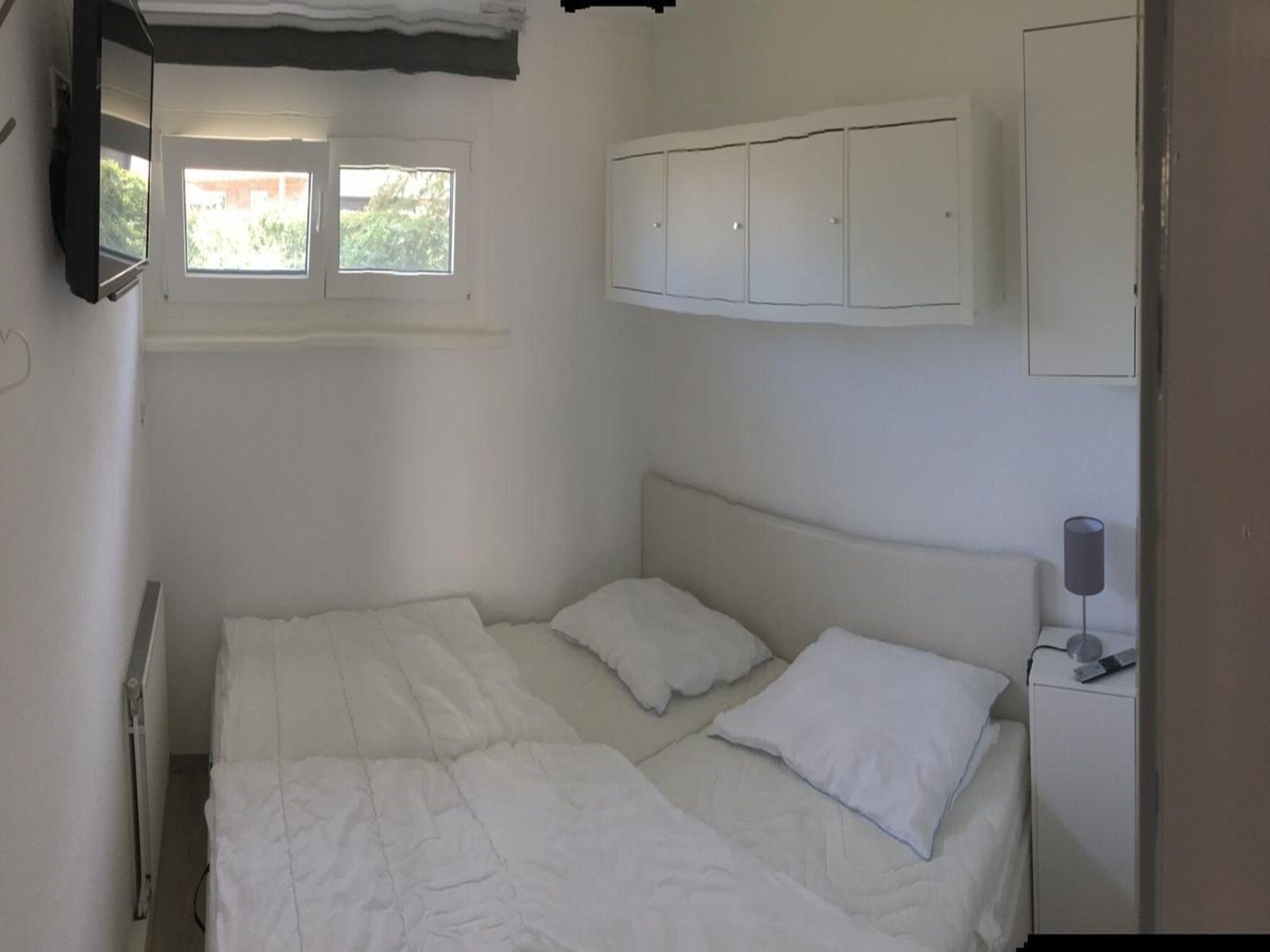 Een slaapkamer van De Schelp 24 in Sint Maartenszee