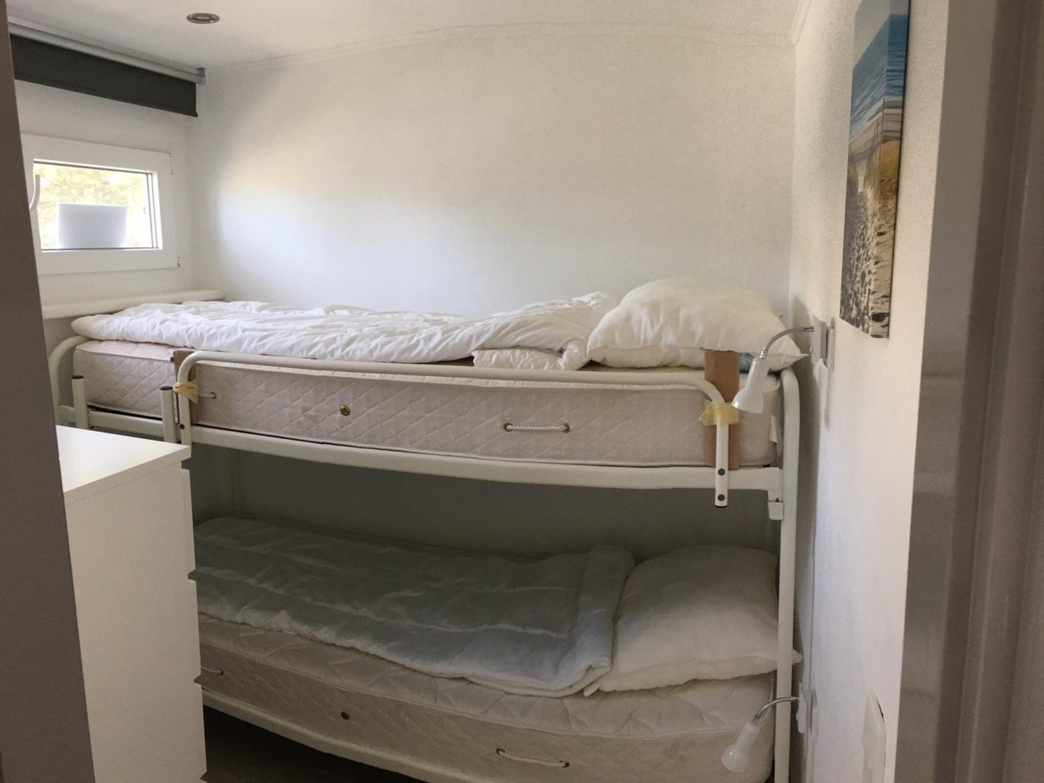 Een slaapkamer van De Schelp 24 in Sint Maartenszee