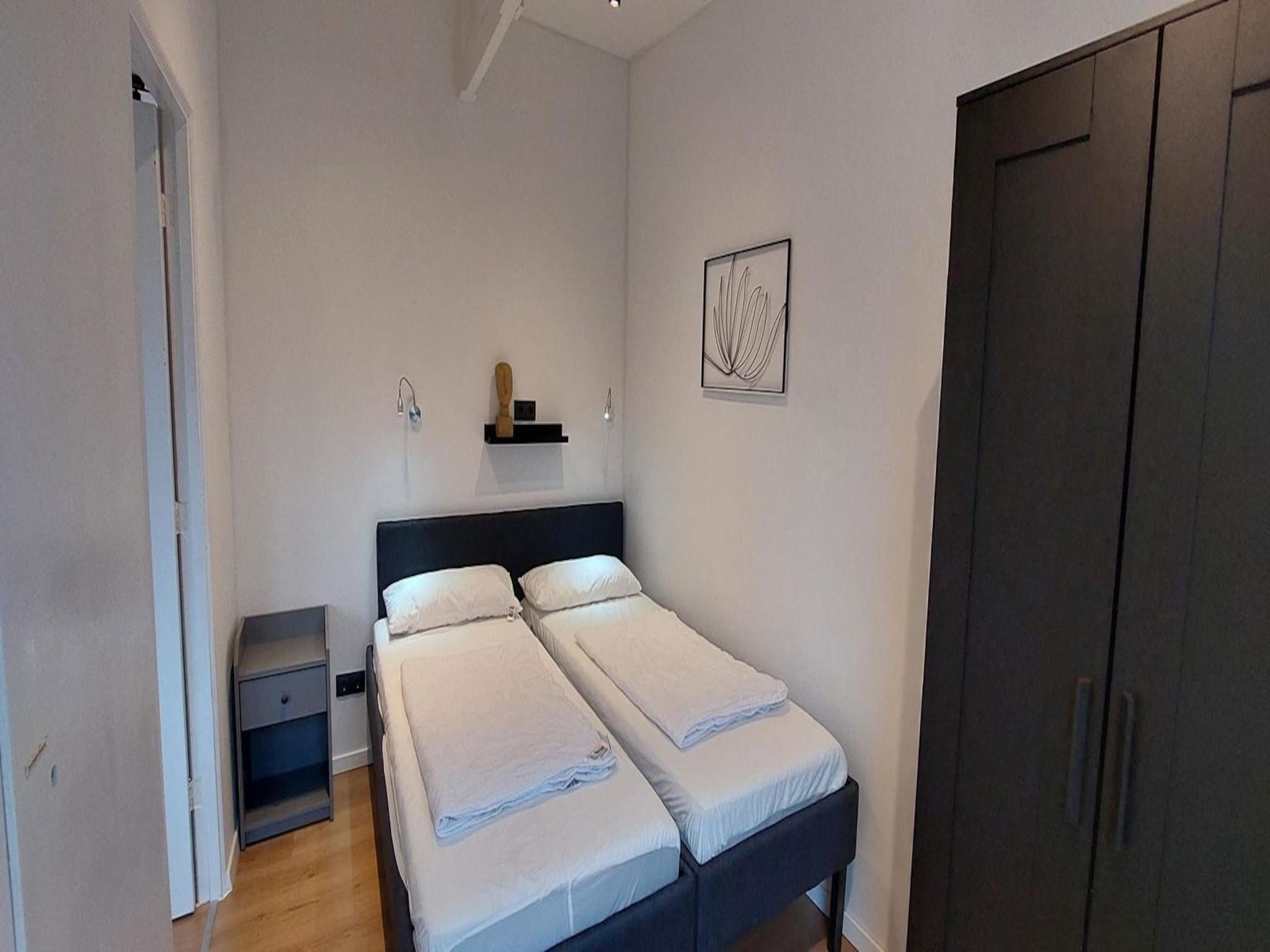 Een slaapkamer van Eureka 13 in Sint Maartenszee