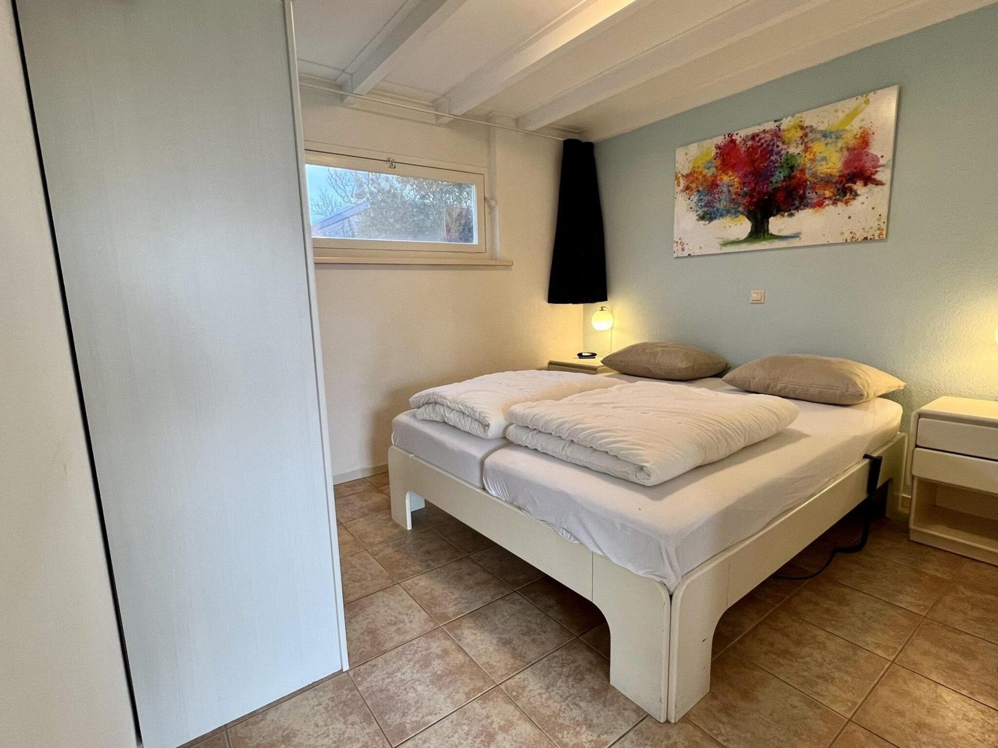 Een slaapkamer van De Schelp 26 in Sint Maartenszee