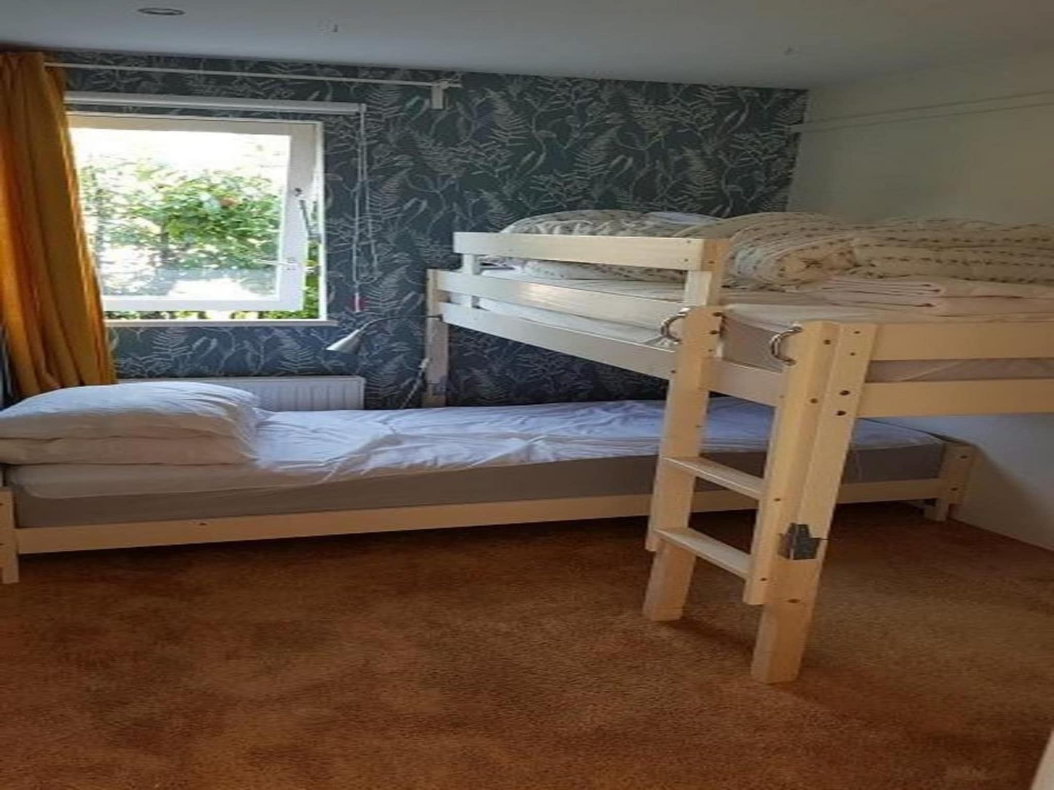 Een slaapkamer van Eb en Vloed 53 in Sint Maartenszee