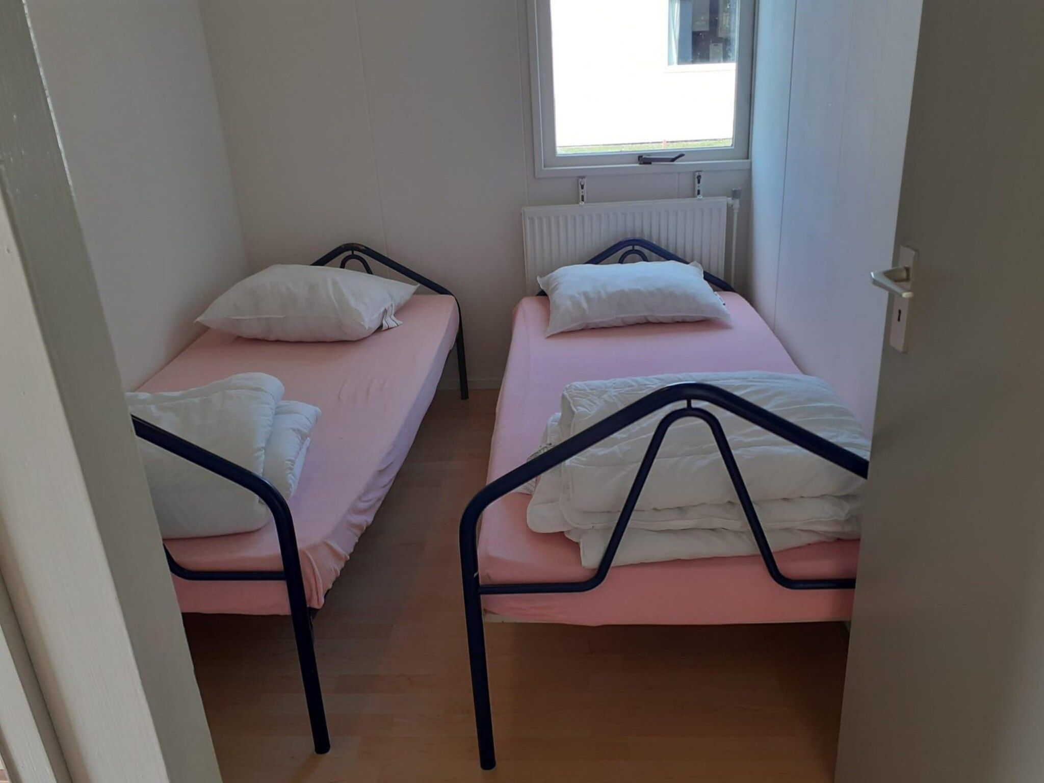 Een slaapkamer van Eb en Vloed 55 in Sint Maartenszee