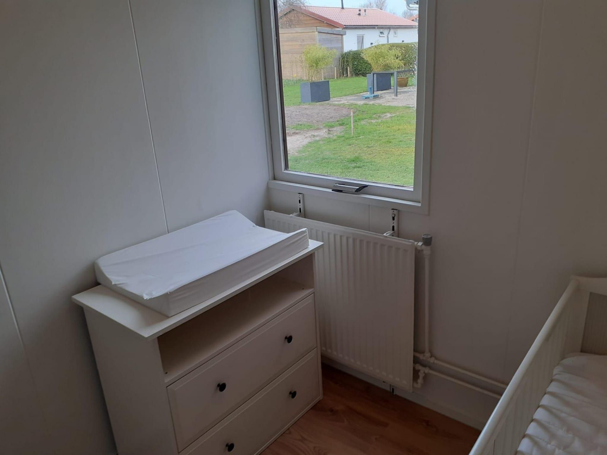 Een slaapkamer van Eb en Vloed 55 in Sint Maartenszee