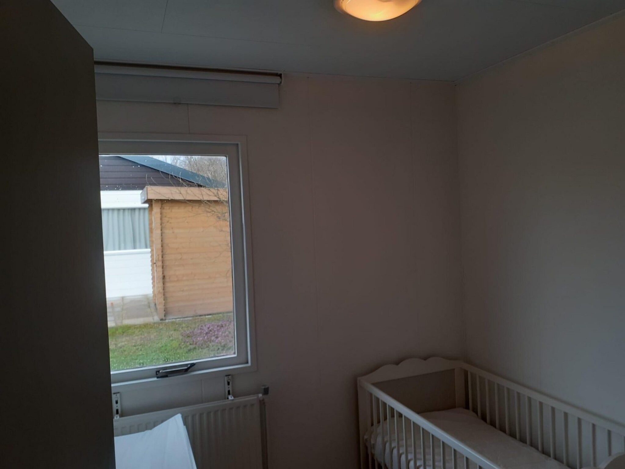 Een slaapkamer van Eb en Vloed 55 in Sint Maartenszee