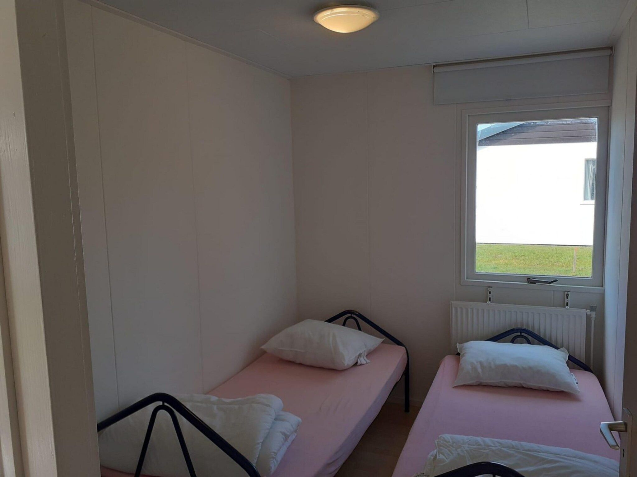 Een slaapkamer van Eb en Vloed 55 in Sint Maartenszee