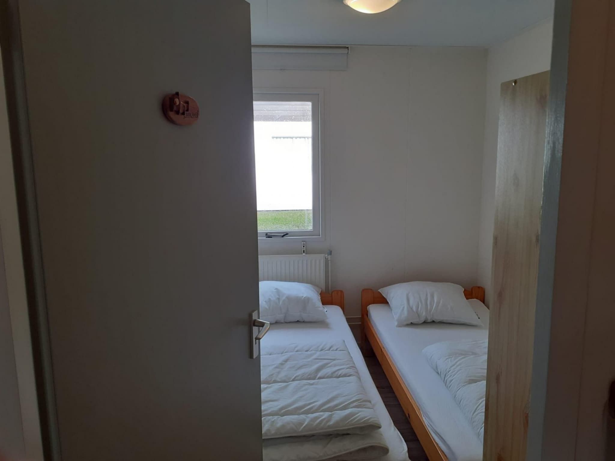 Een slaapkamer van Eb en Vloed 55 in Sint Maartenszee