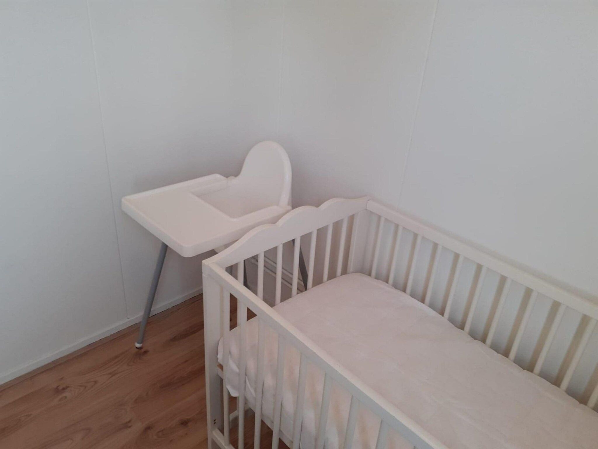 Een slaapkamer van Eb en Vloed 55 in Sint Maartenszee