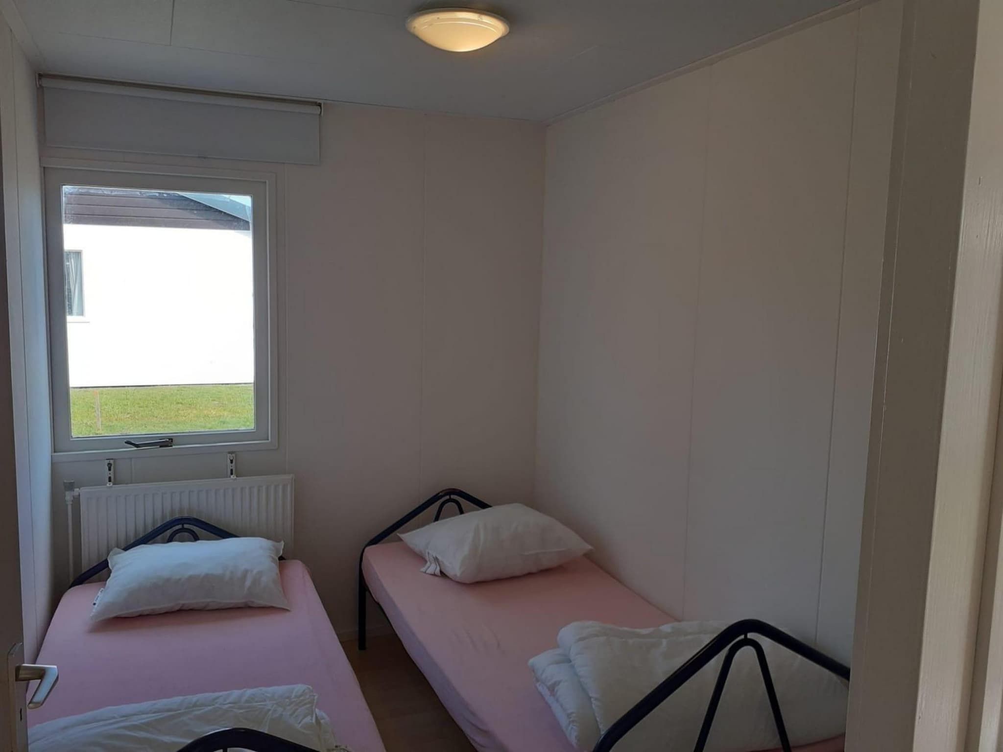 Een slaapkamer van Eb en Vloed 55 in Sint Maartenszee