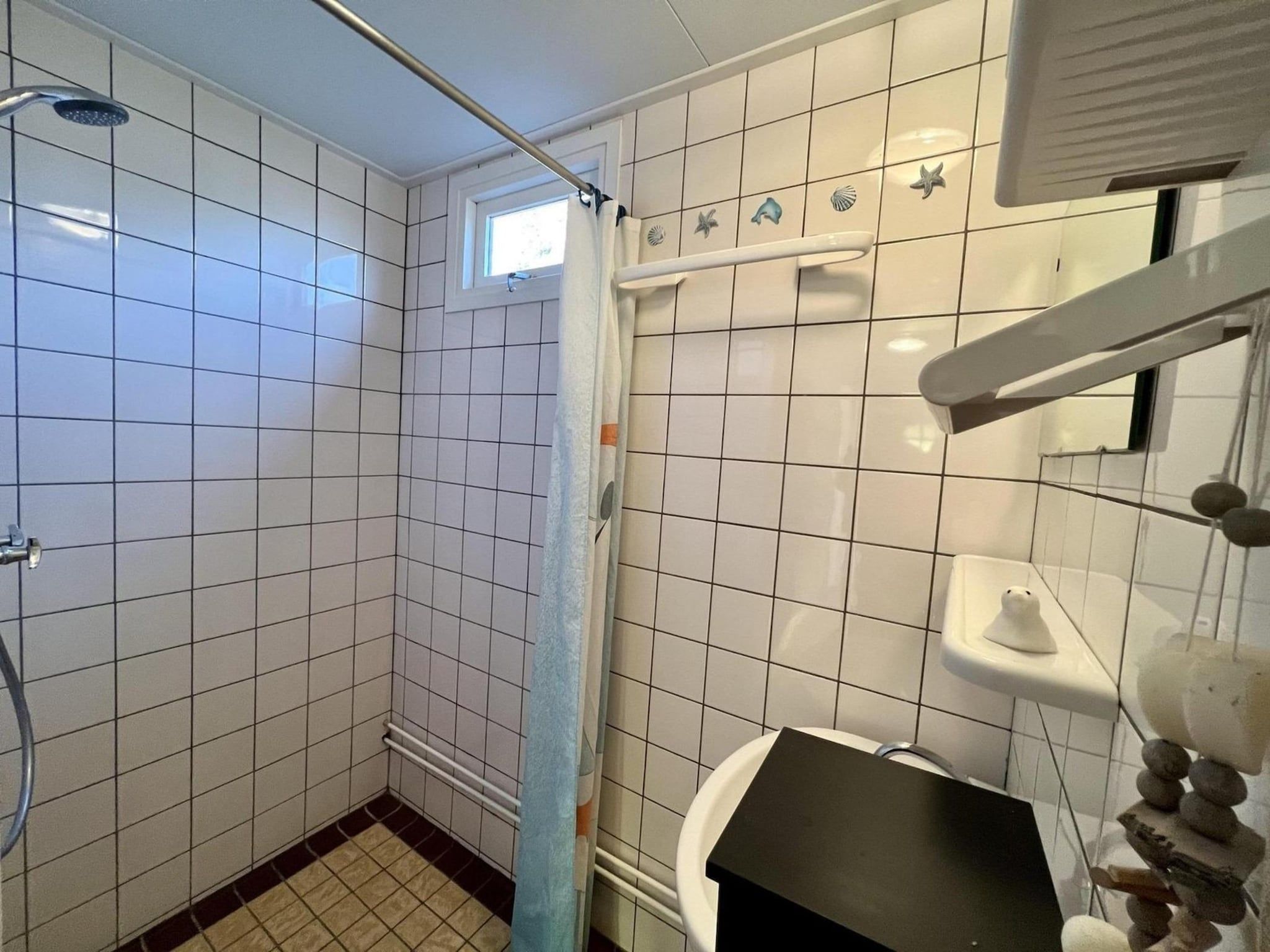 Een slaapkamer van Eb en Vloed 55 in Sint Maartenszee