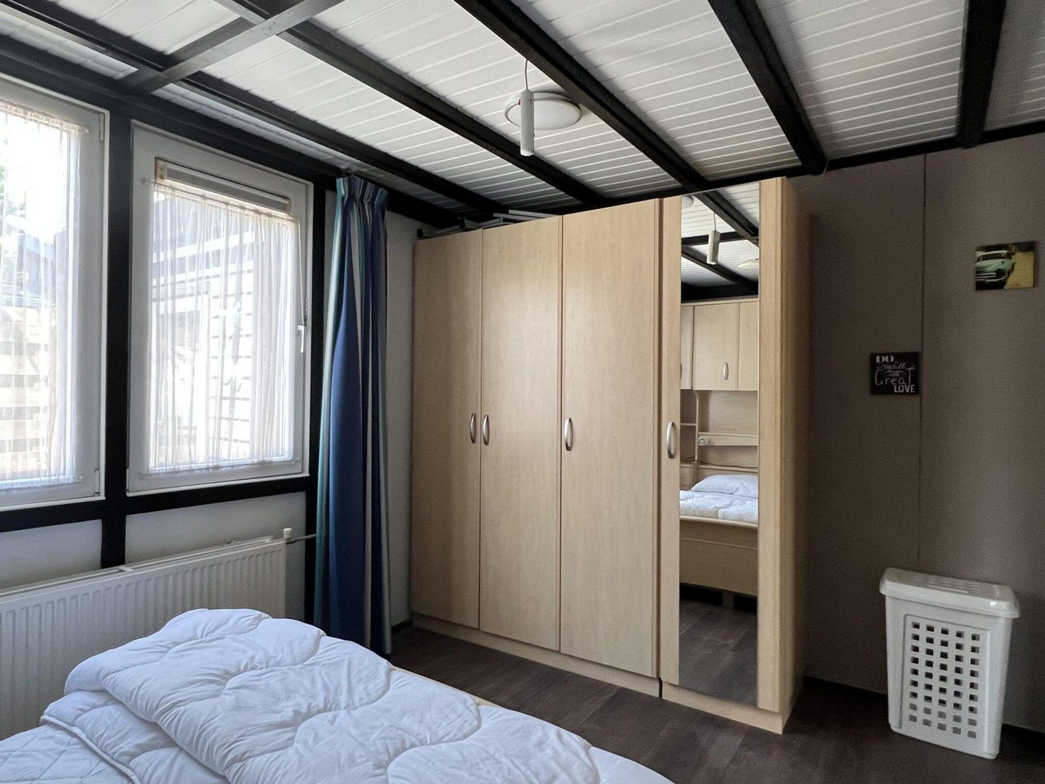 Een slaapkamer van Eb en Vloed 58 in Sint Maartenszee