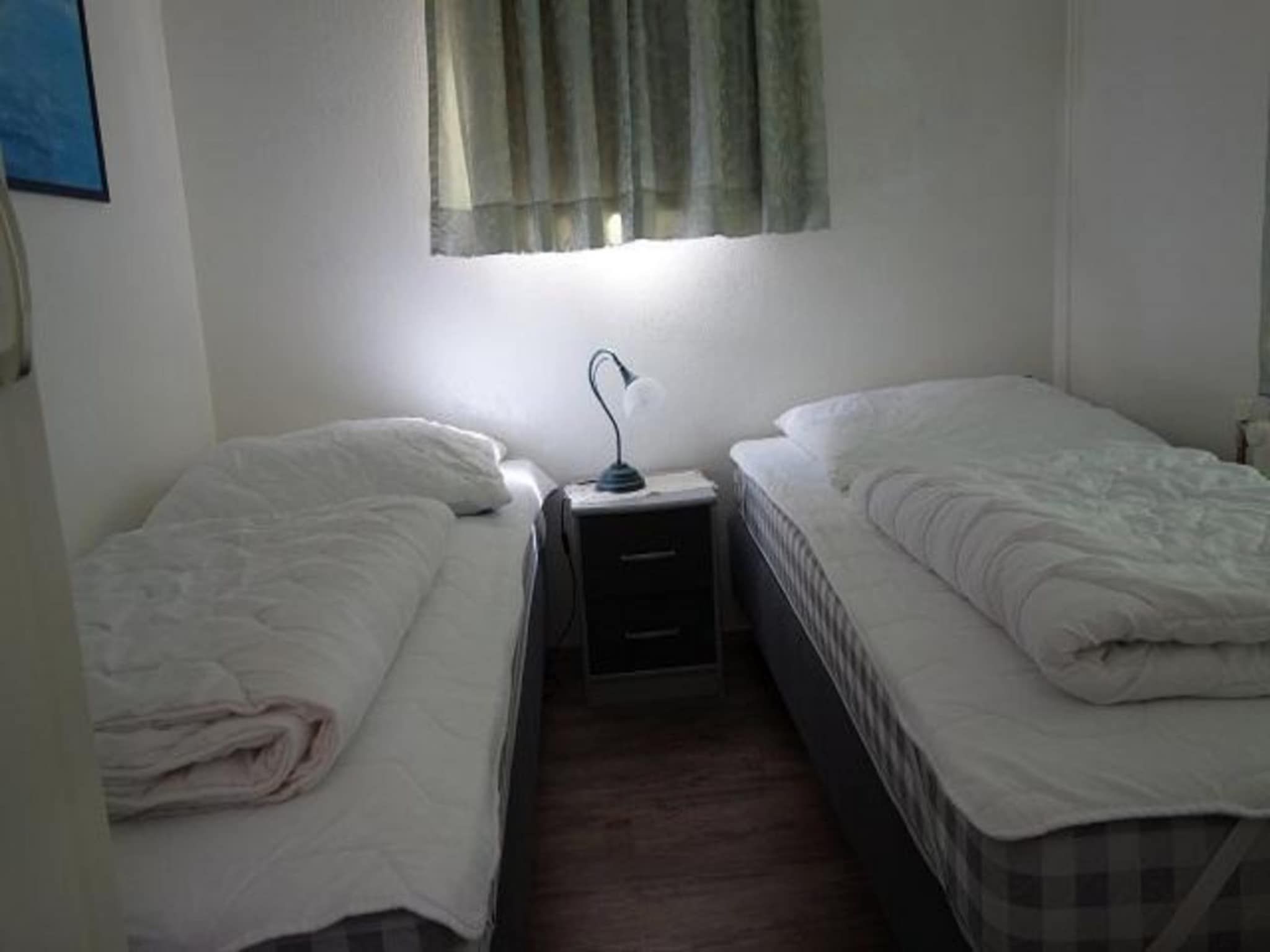 Een slaapkamer van Eureka 032 in Sint Maartenszee