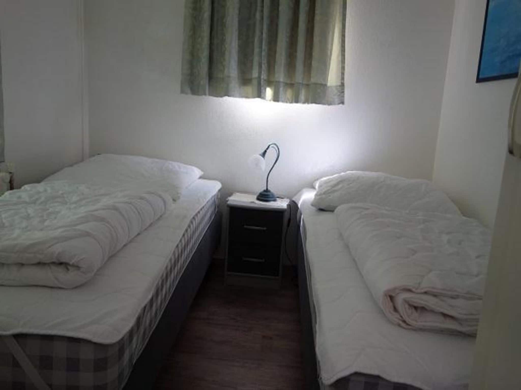 Een slaapkamer van Eureka 032 in Sint Maartenszee