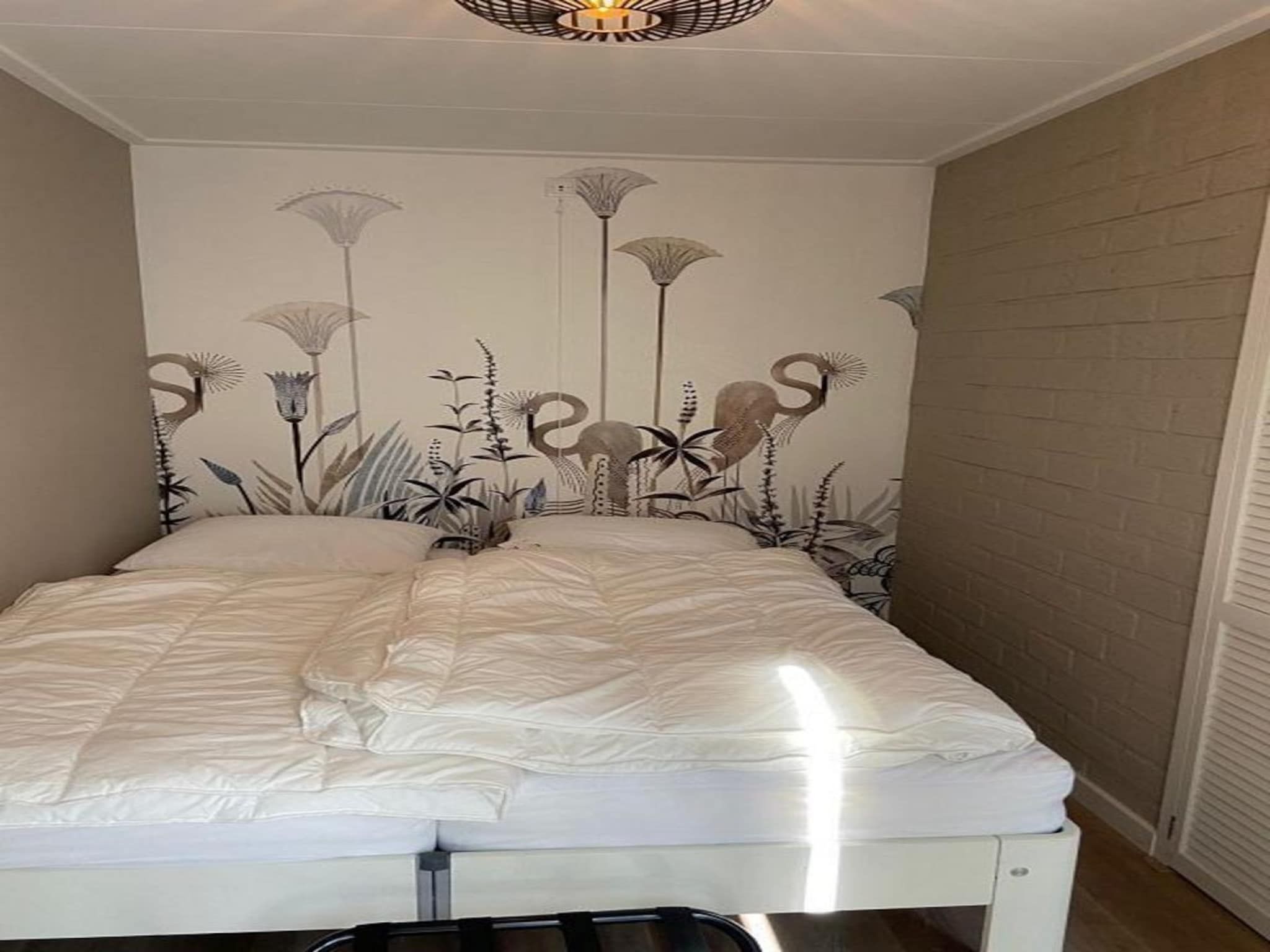 Een slaapkamer van Kloosterbos 4 in Sint Maartensbrug