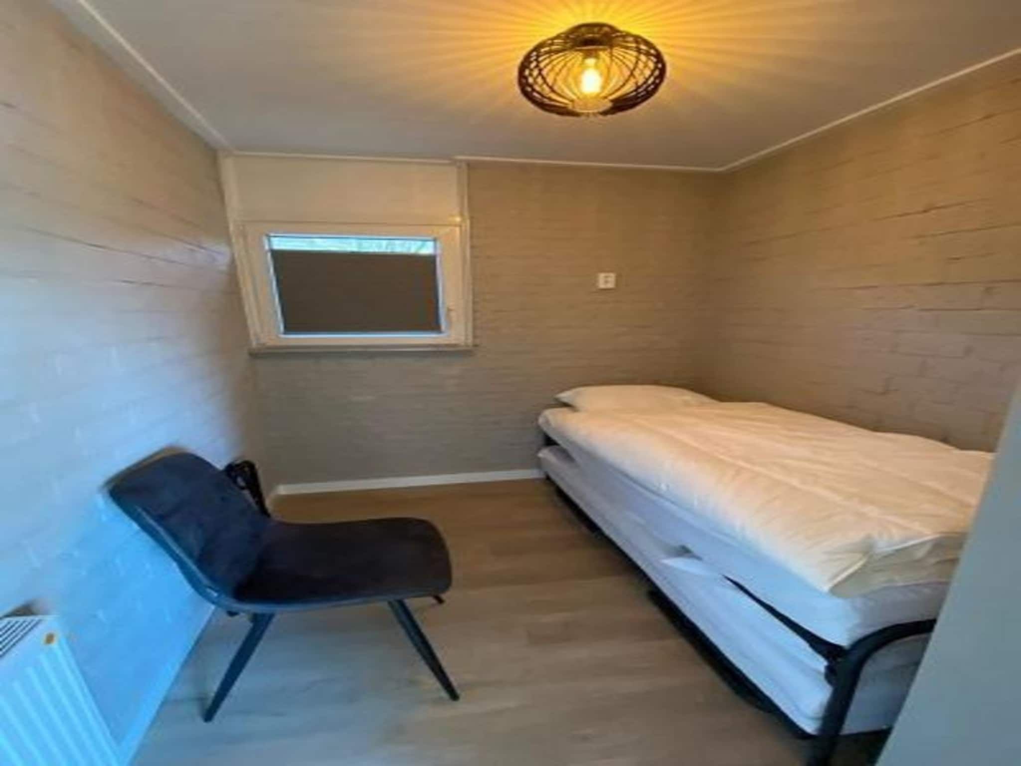 Een slaapkamer van Kloosterbos 4 in Sint Maartensbrug