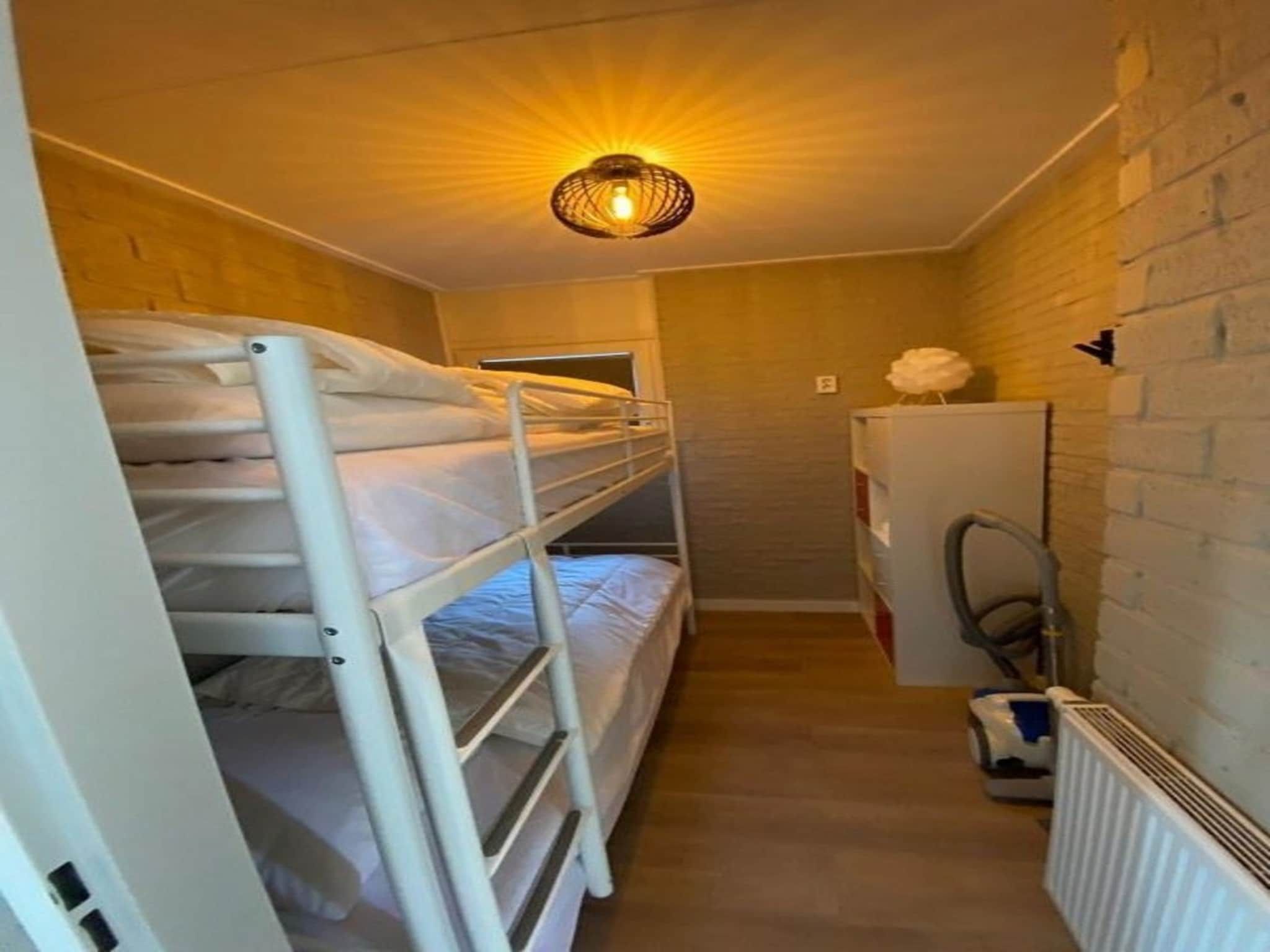 Een slaapkamer van Kloosterbos 4 in Sint Maartensbrug