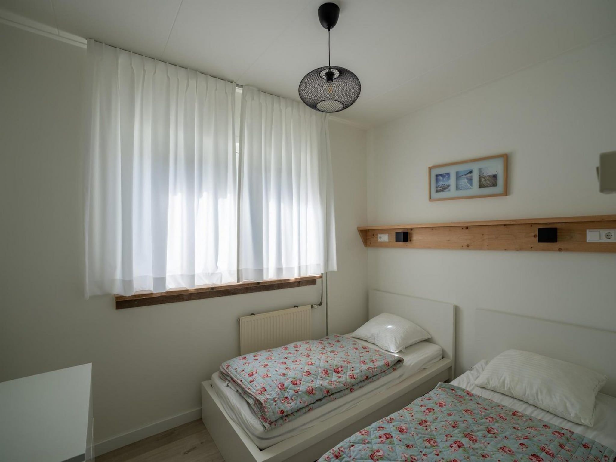 Een slaapkamer van Korfwaterweg 41 in Petten