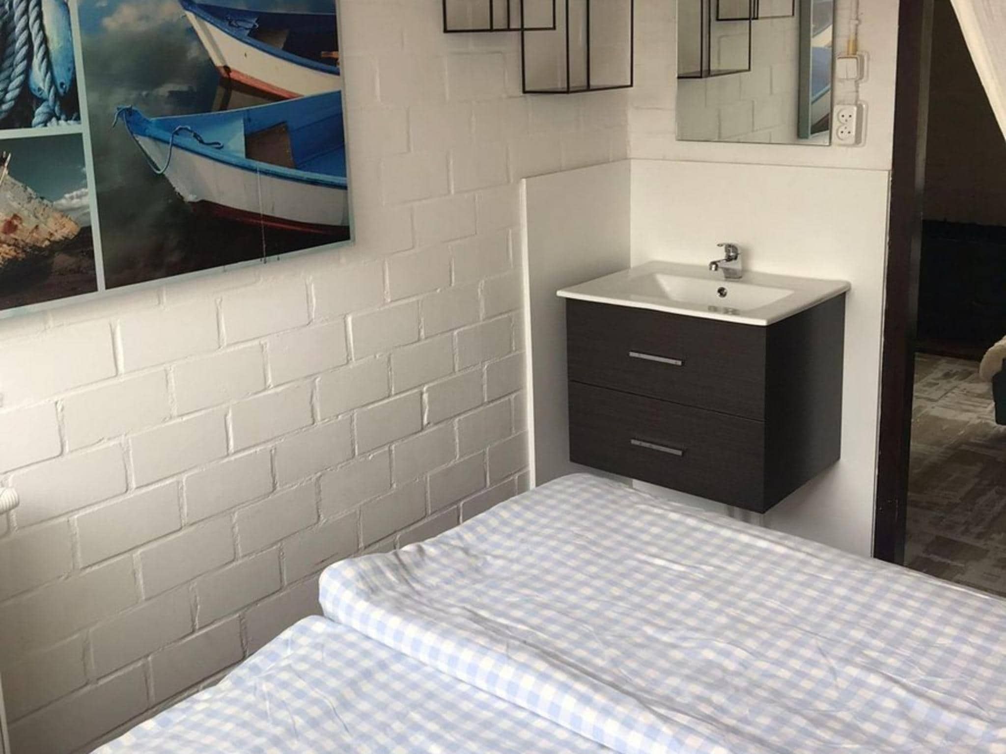 Een slaapkamer van Ruyghe Hoeck 4 in Sint Maartensbrug