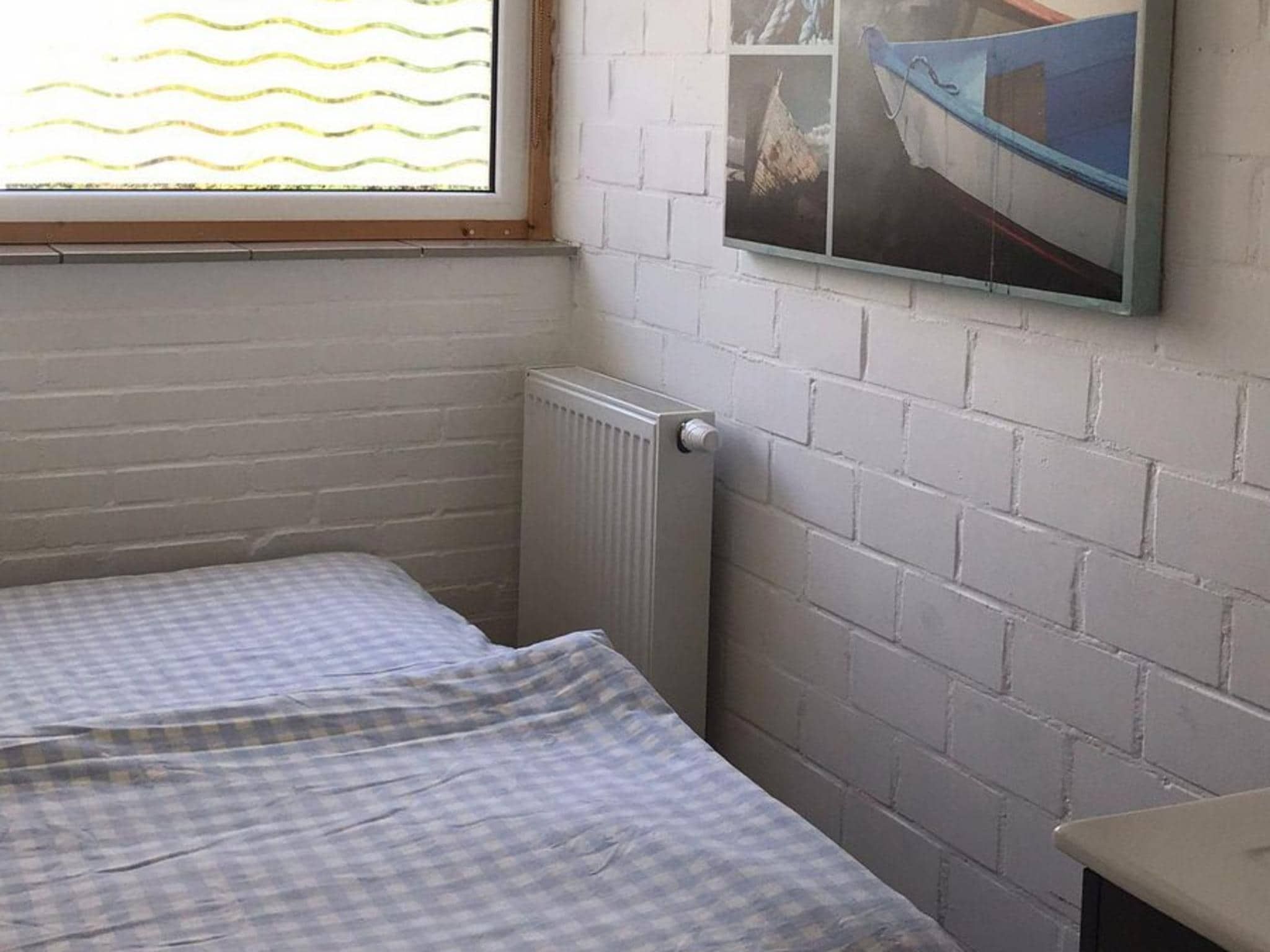 Een slaapkamer van Ruyghe Hoeck 4 in Sint Maartensbrug