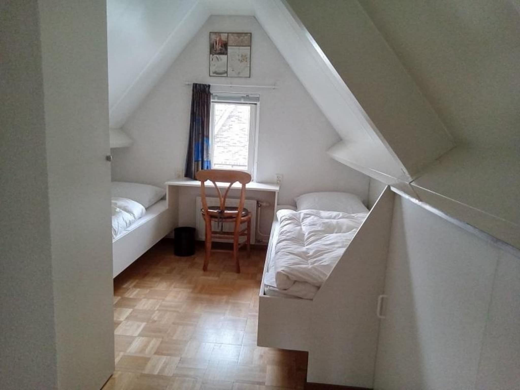 Een slaapkamer van Singel 62 in Petten