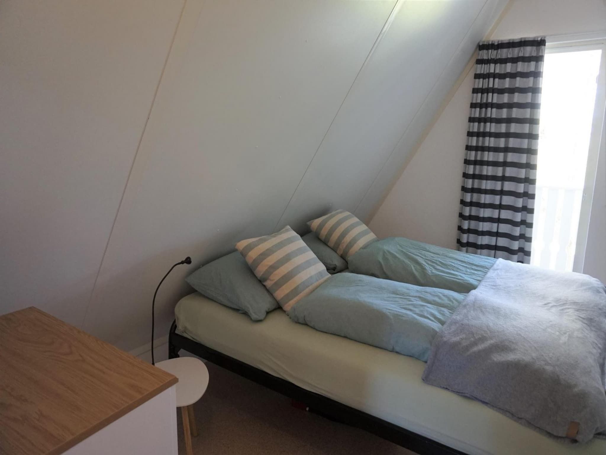 Een slaapkamer van Vogelvrij 4 in Burgerbrug