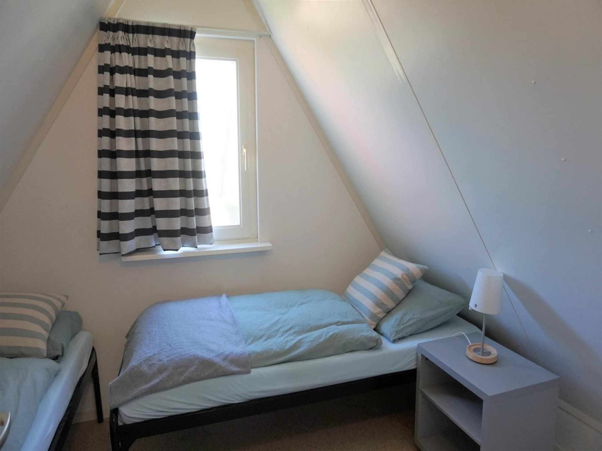 Een slaapkamer van Vogelvrij 4 in Burgerbrug