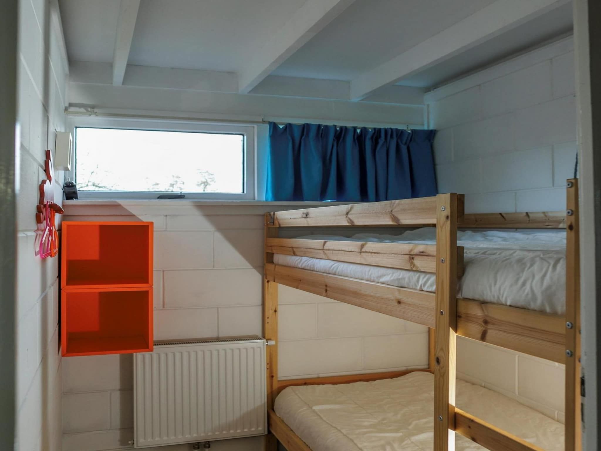 Een slaapkamer van Wildrijk 21 in Sint Maartenszee