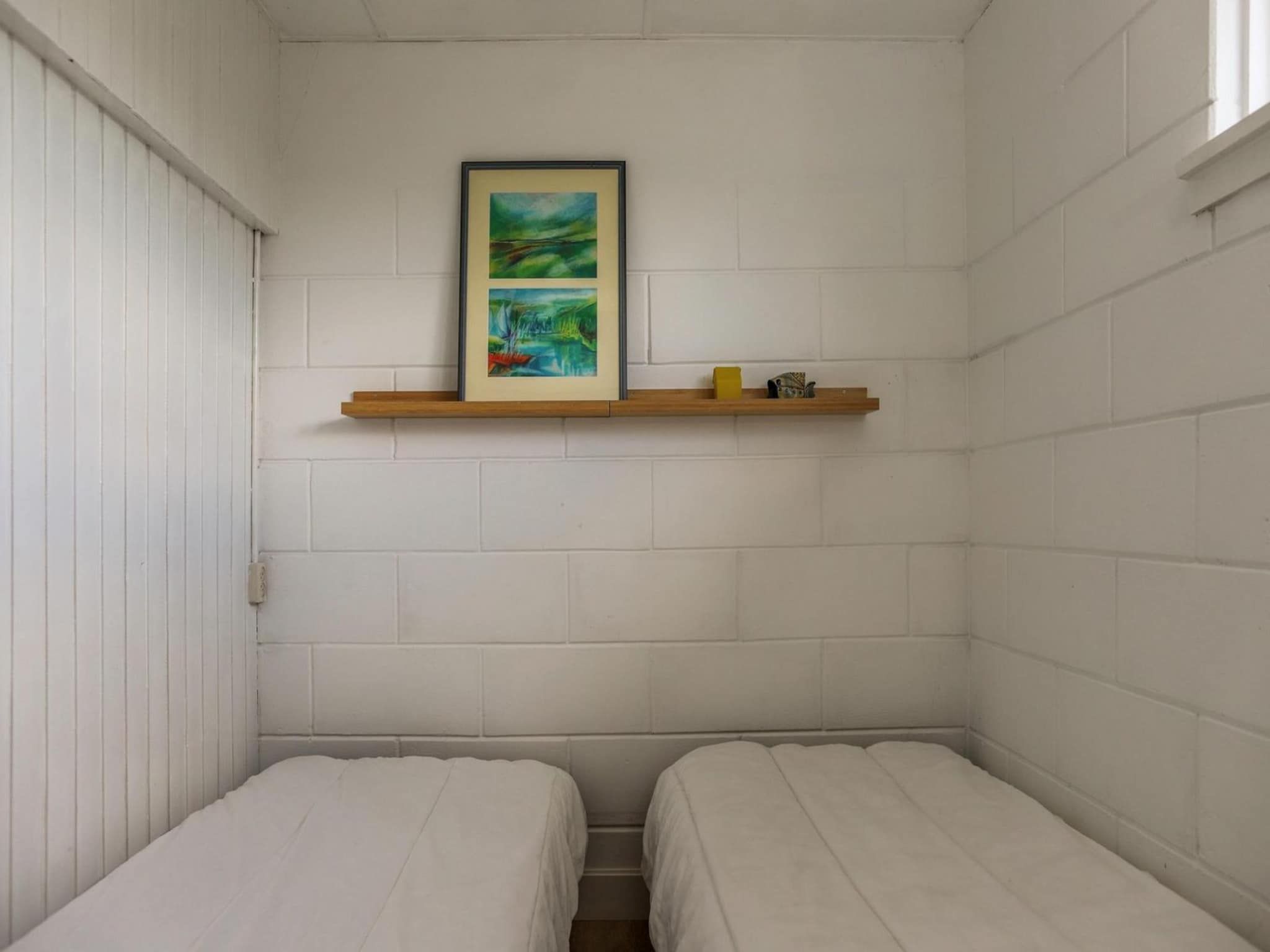 Een slaapkamer van Wildrijk 21 in Sint Maartenszee