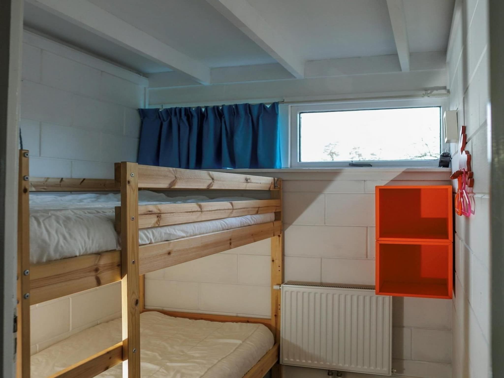 Een slaapkamer van Wildrijk 21 in Sint Maartenszee