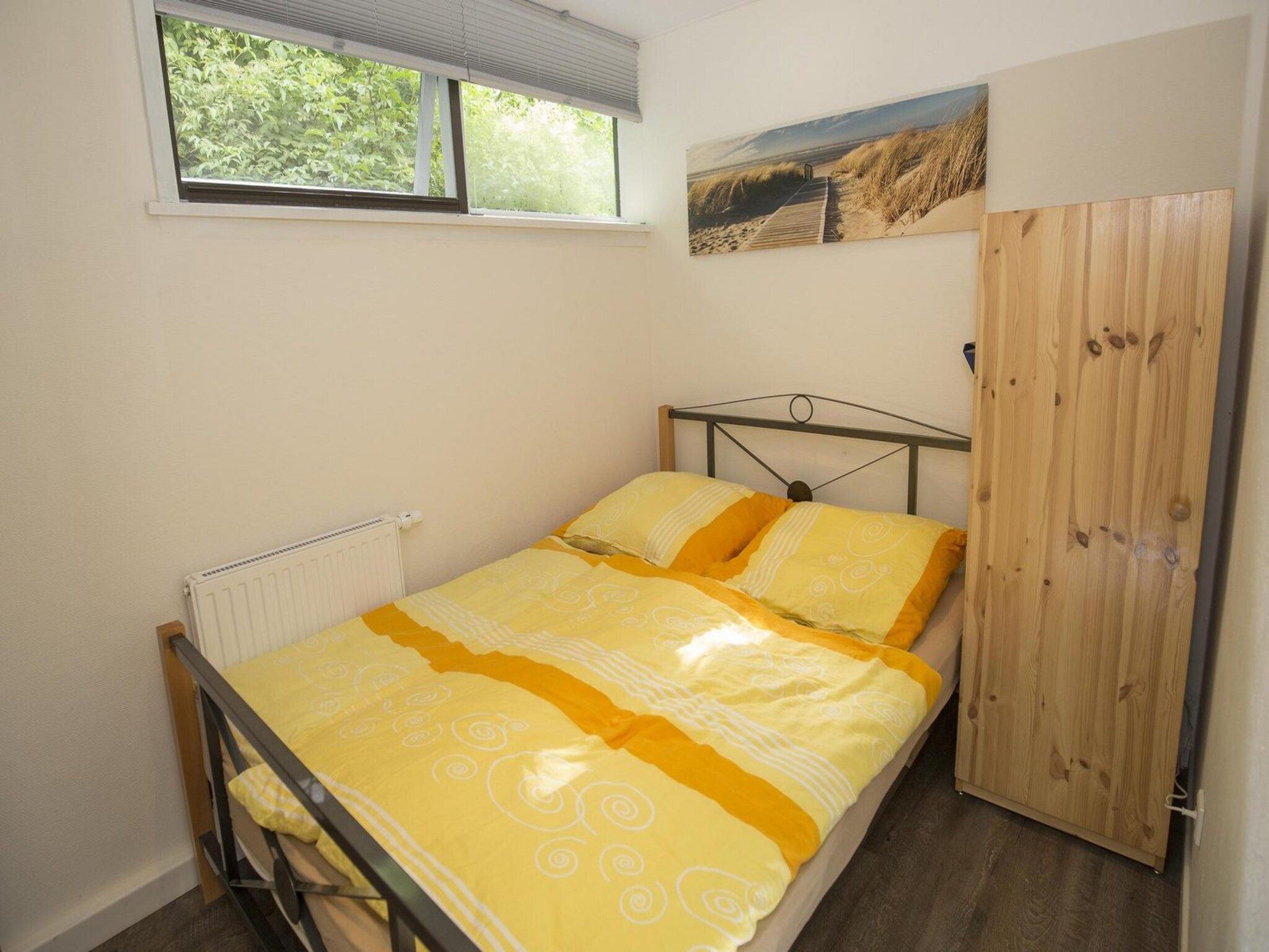 Een slaapkamer van Wildrijk 035 in Sint Maartenszee