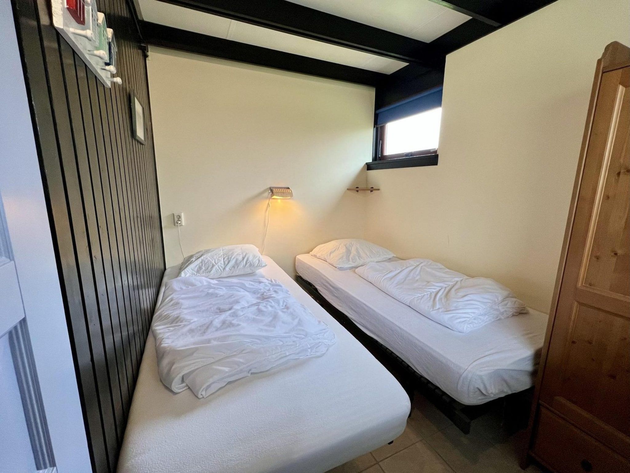 Een slaapkamer van Wildrijk 96 in Sint Maartenszee
