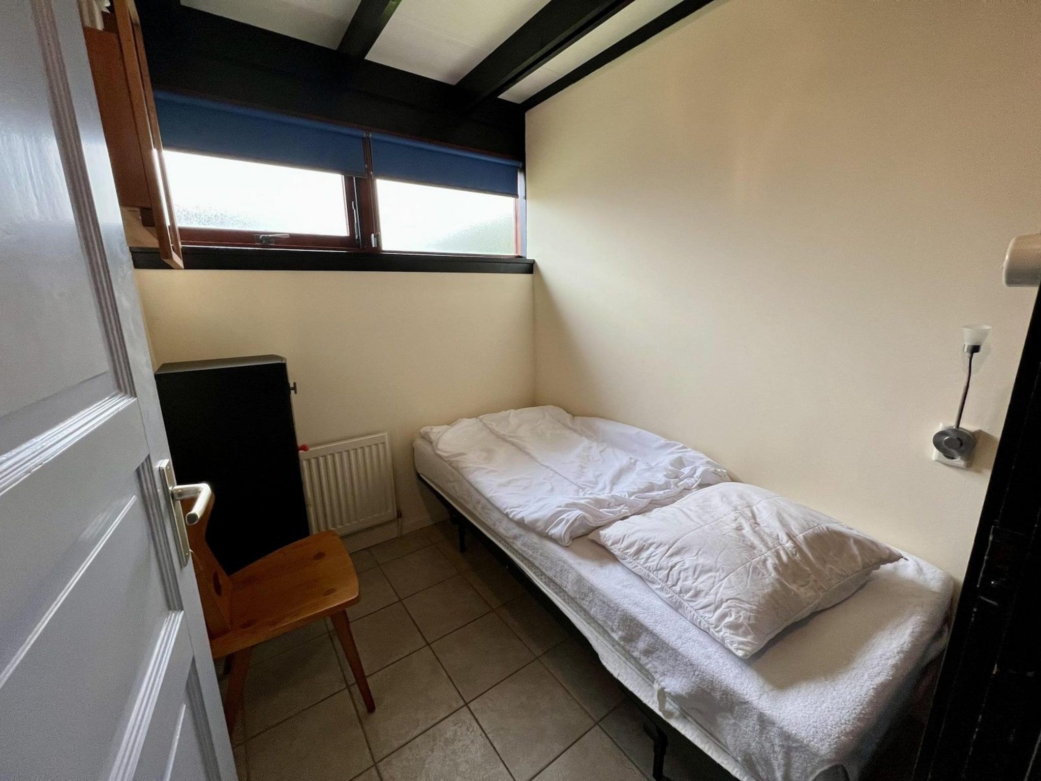 Een slaapkamer van Wildrijk 96 in Sint Maartenszee