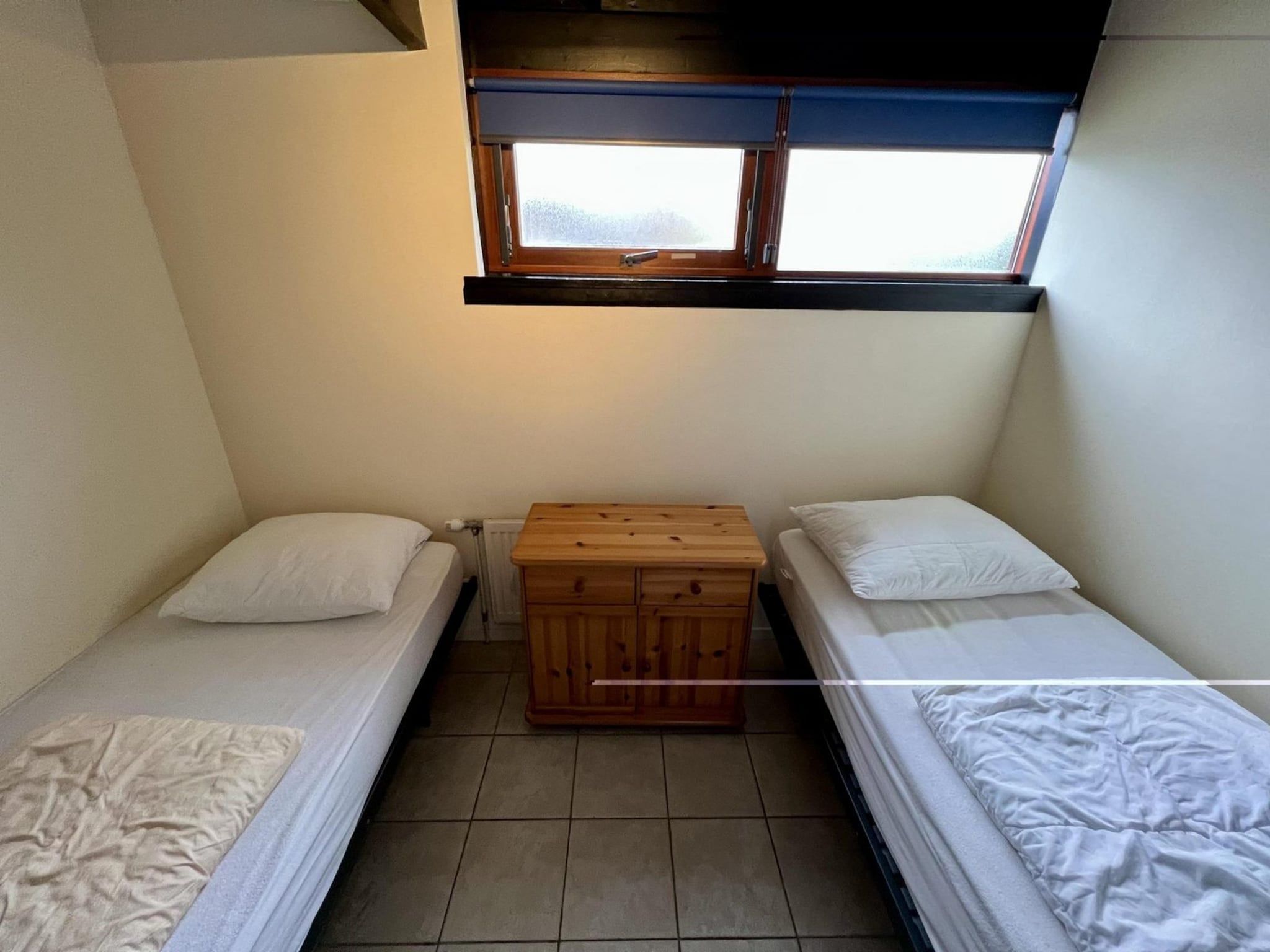 Een slaapkamer van Wildrijk 96 in Sint Maartenszee