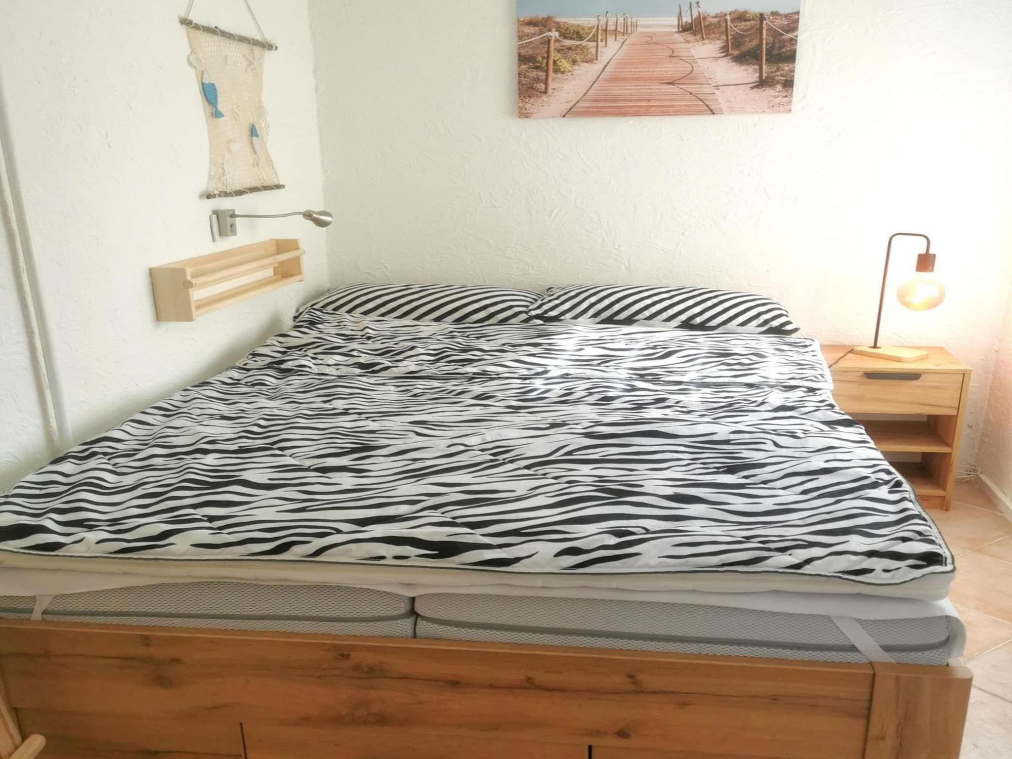 Een slaapkamer van Wildrijk 108 in Sint Maartenszee