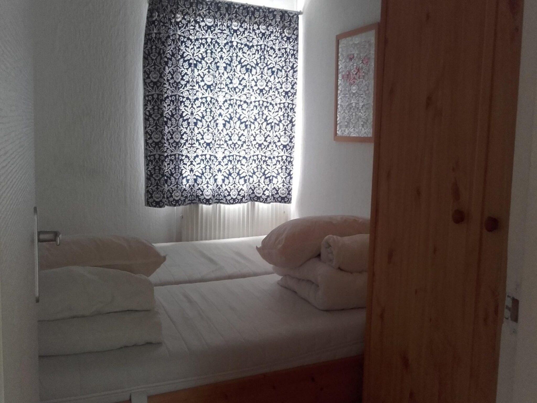 Een slaapkamer van Zeewaard 5 in Sint Maartenszee