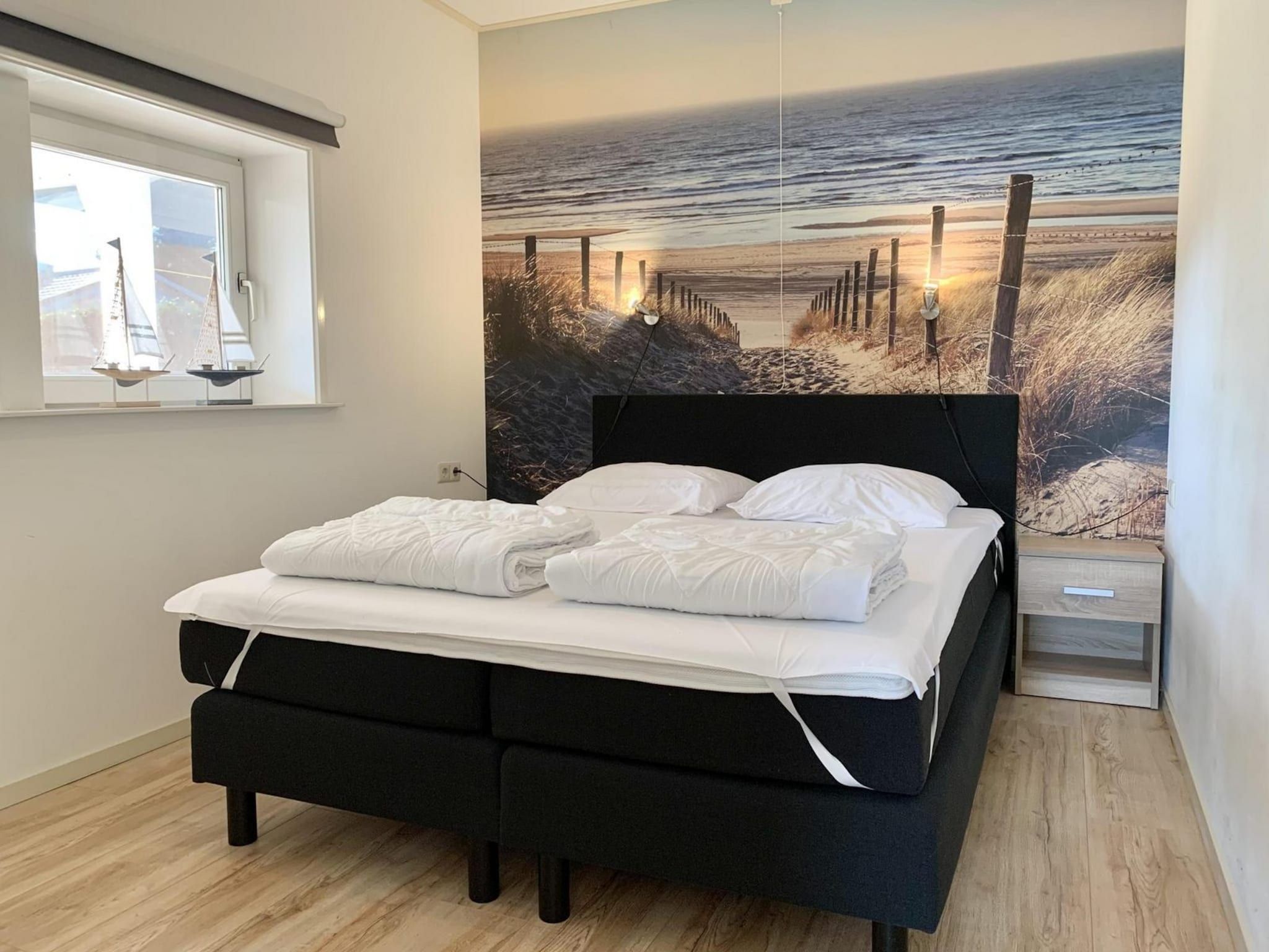 Een slaapkamer van Zeewaard 14 in Sint Maartenszee