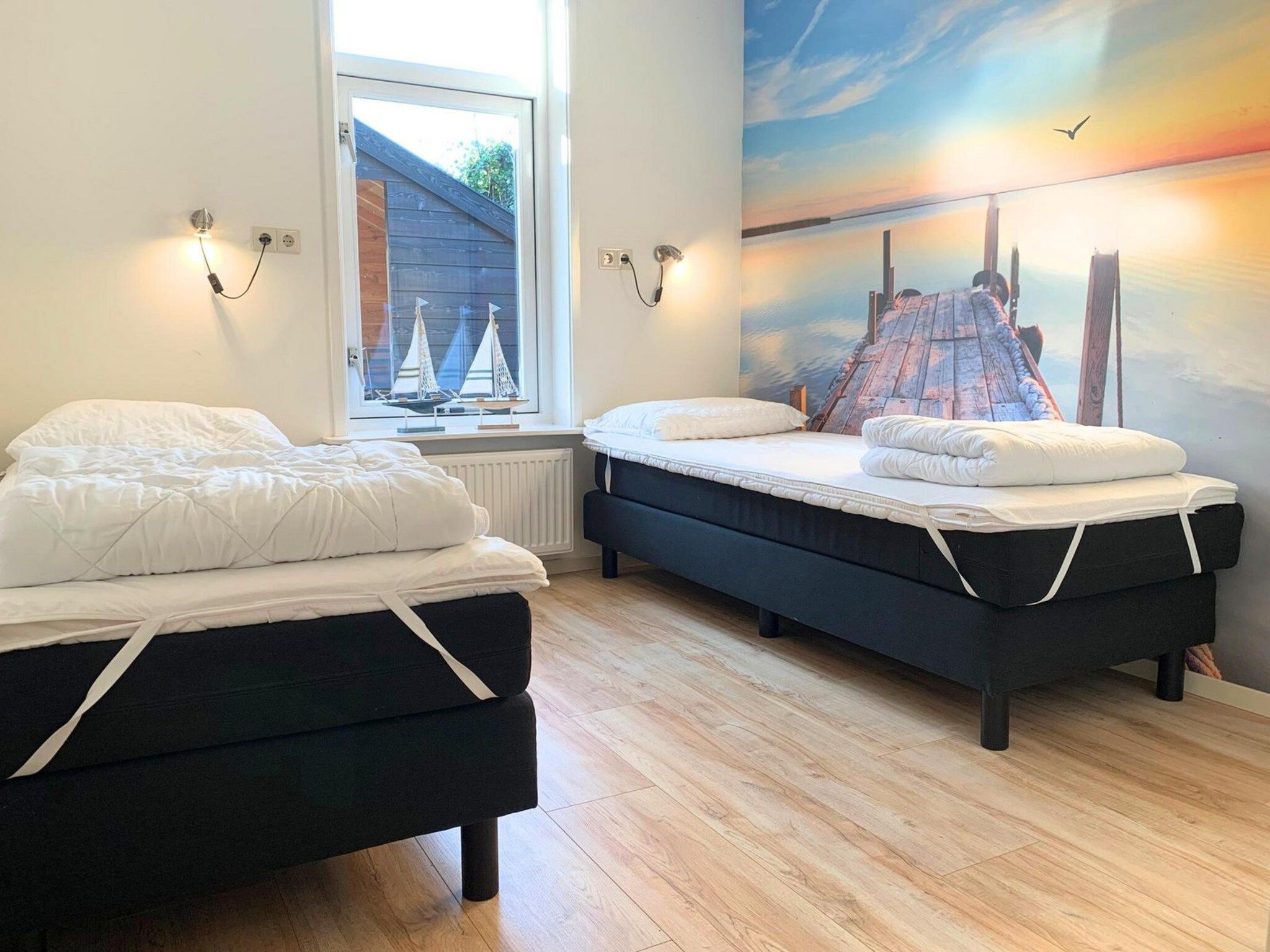 Een slaapkamer van Zeewaard 14 in Sint Maartenszee