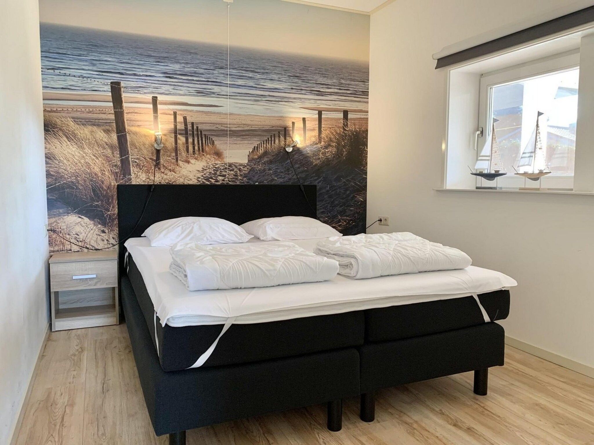 Een slaapkamer van Zeewaard 14 in Sint Maartenszee