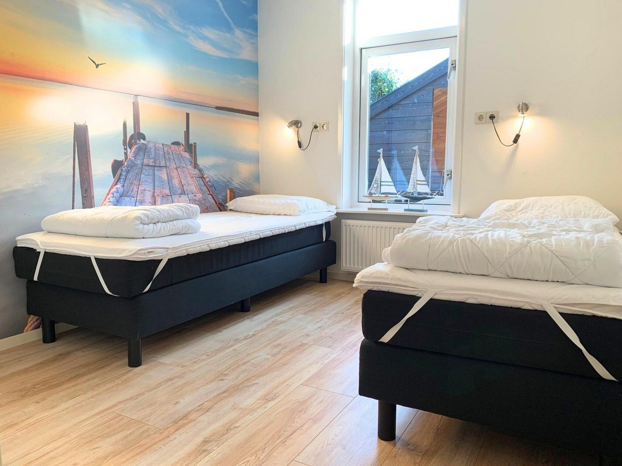 Een slaapkamer van Zeewaard 14 in Sint Maartenszee