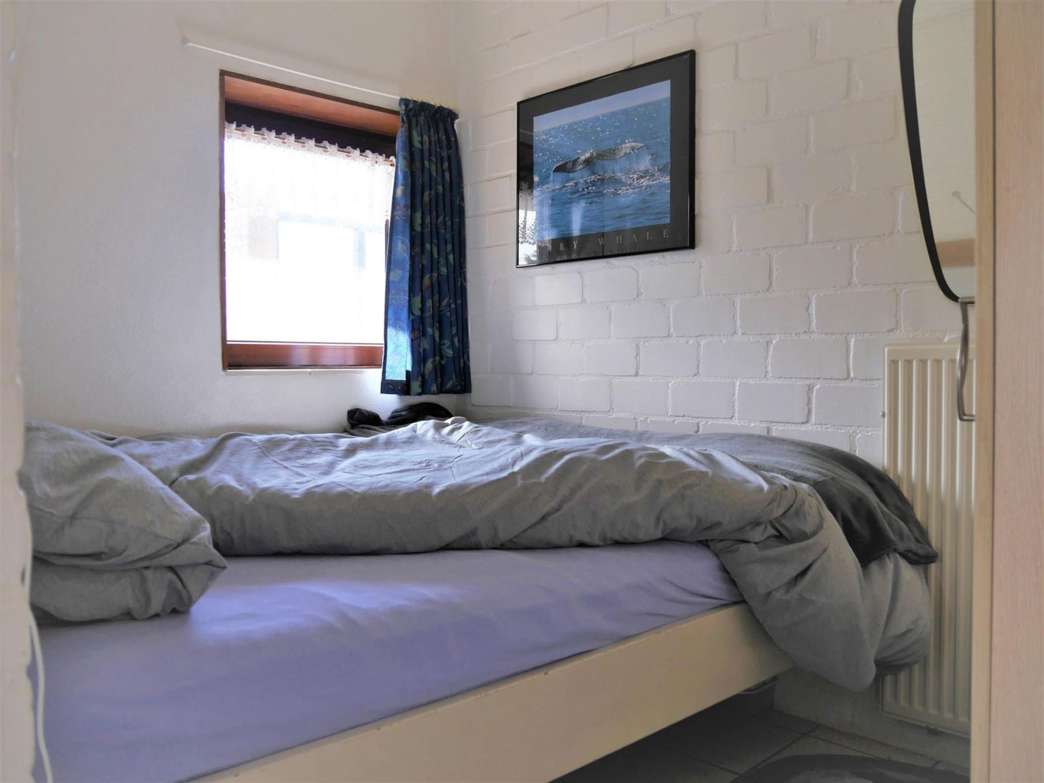 Een slaapkamer van Zeewaard 15 in Sint Maartenszee