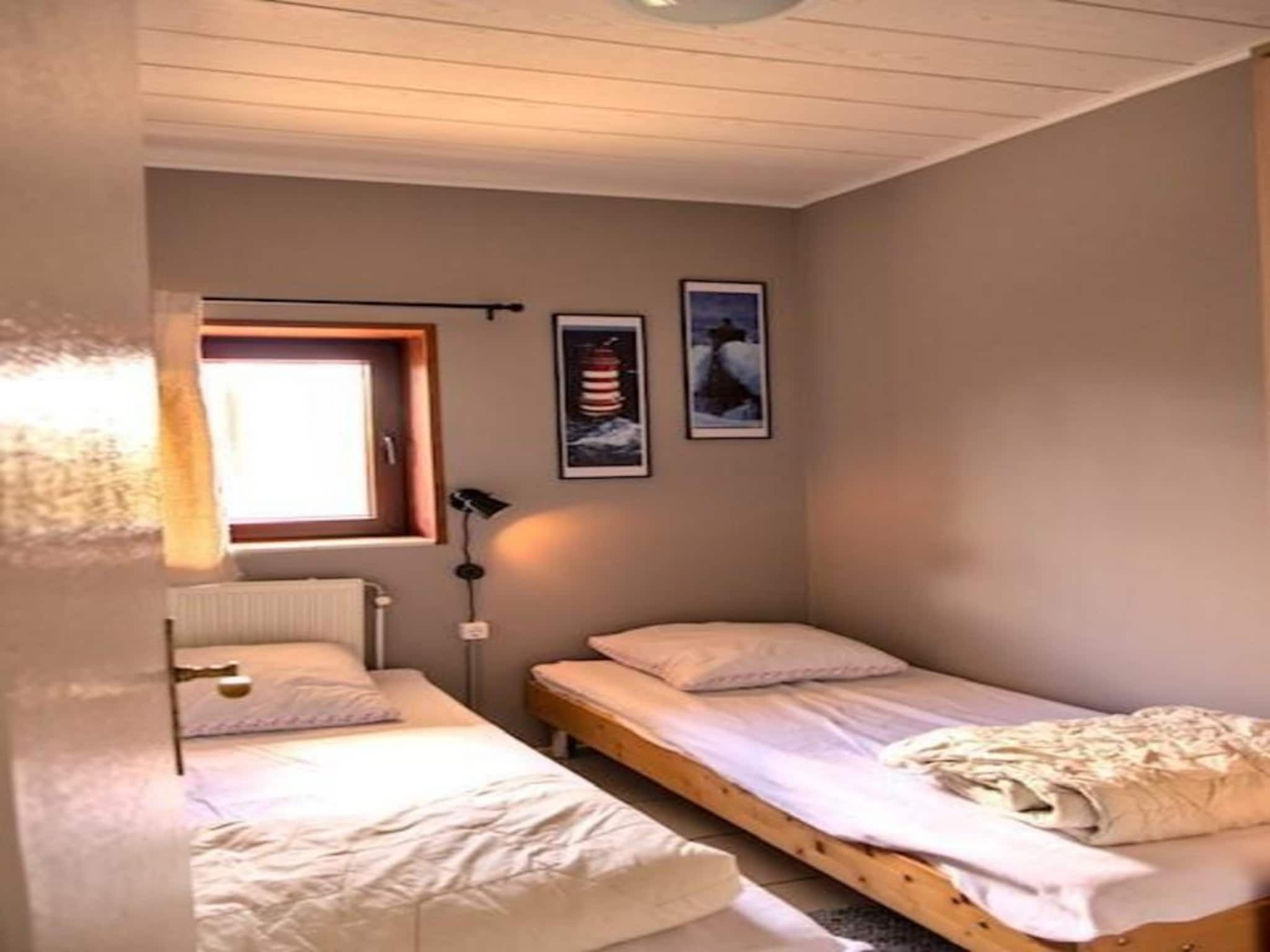 Een slaapkamer van Zeewaard 15 in Sint Maartenszee