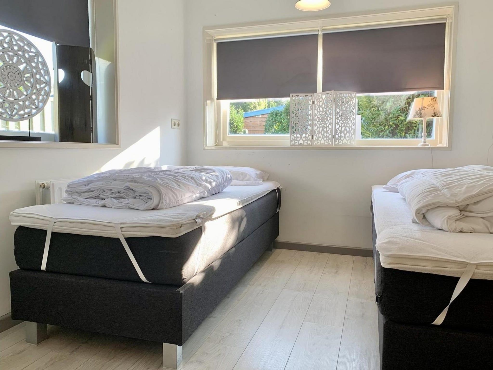 Een slaapkamer van Zeewaard 21 in Sint Maartenszee