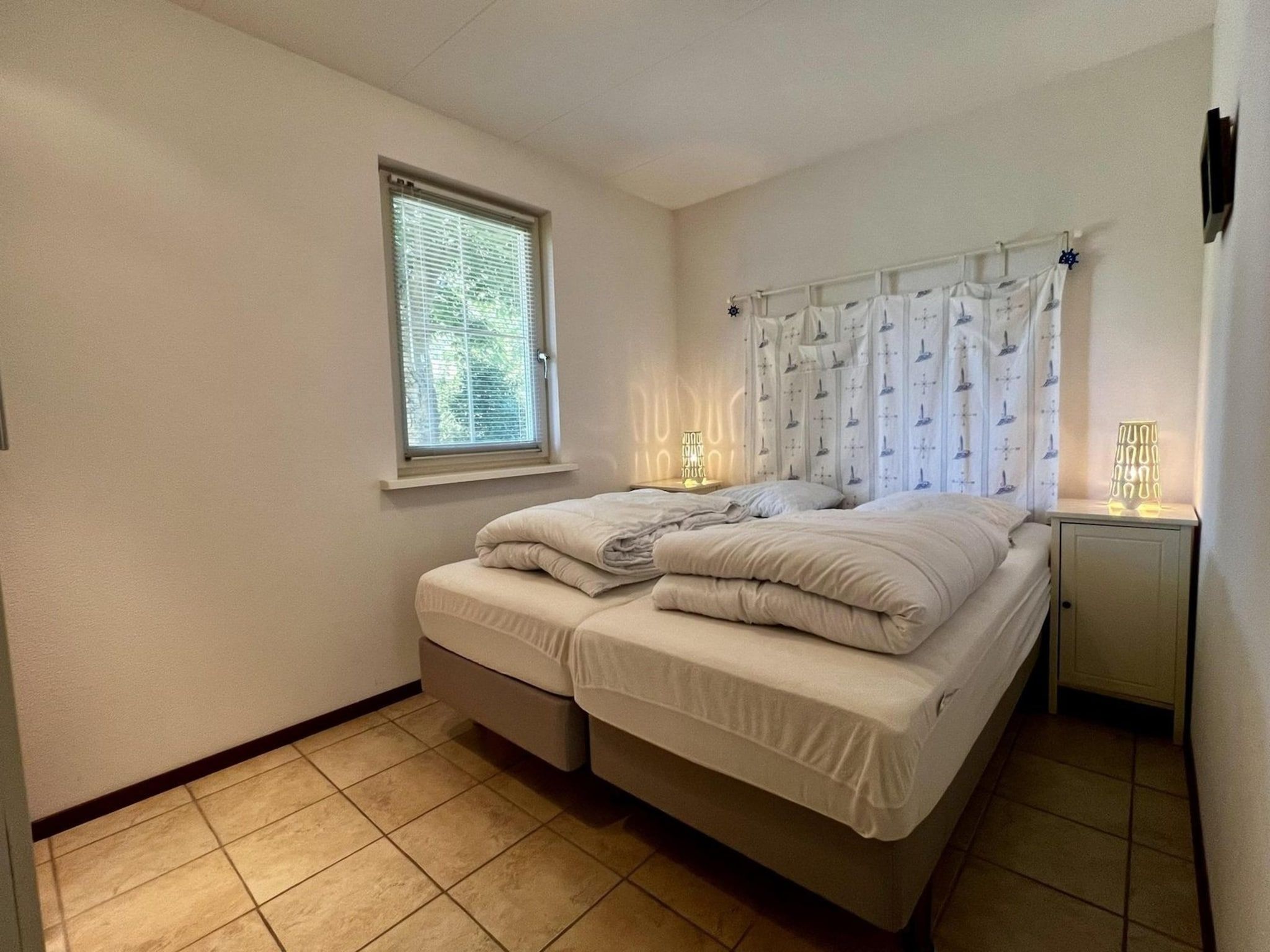 Een slaapkamer van Eureka 100 in Sint Maartenszee
