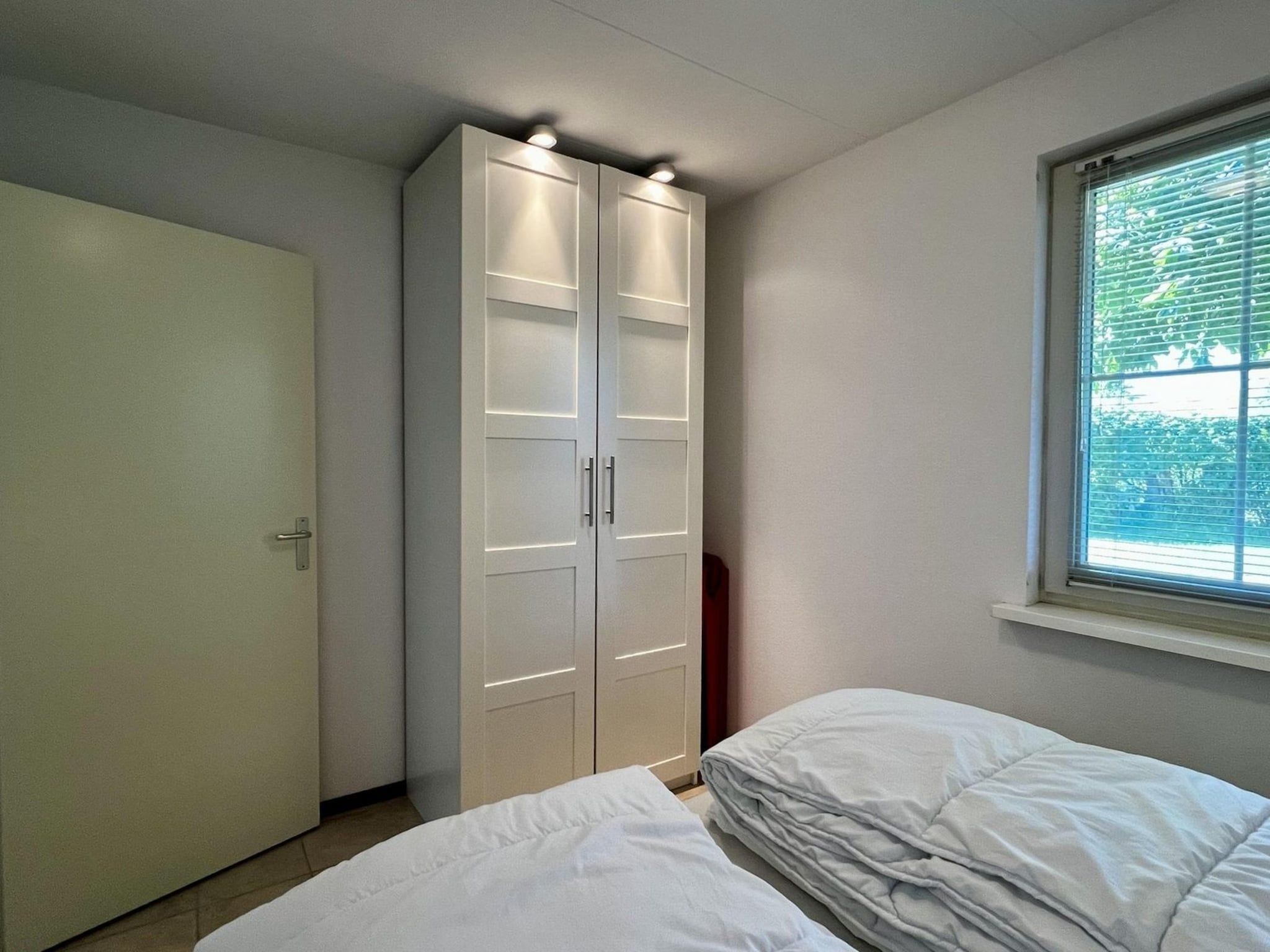 Een slaapkamer van Eureka 100 in Sint Maartenszee