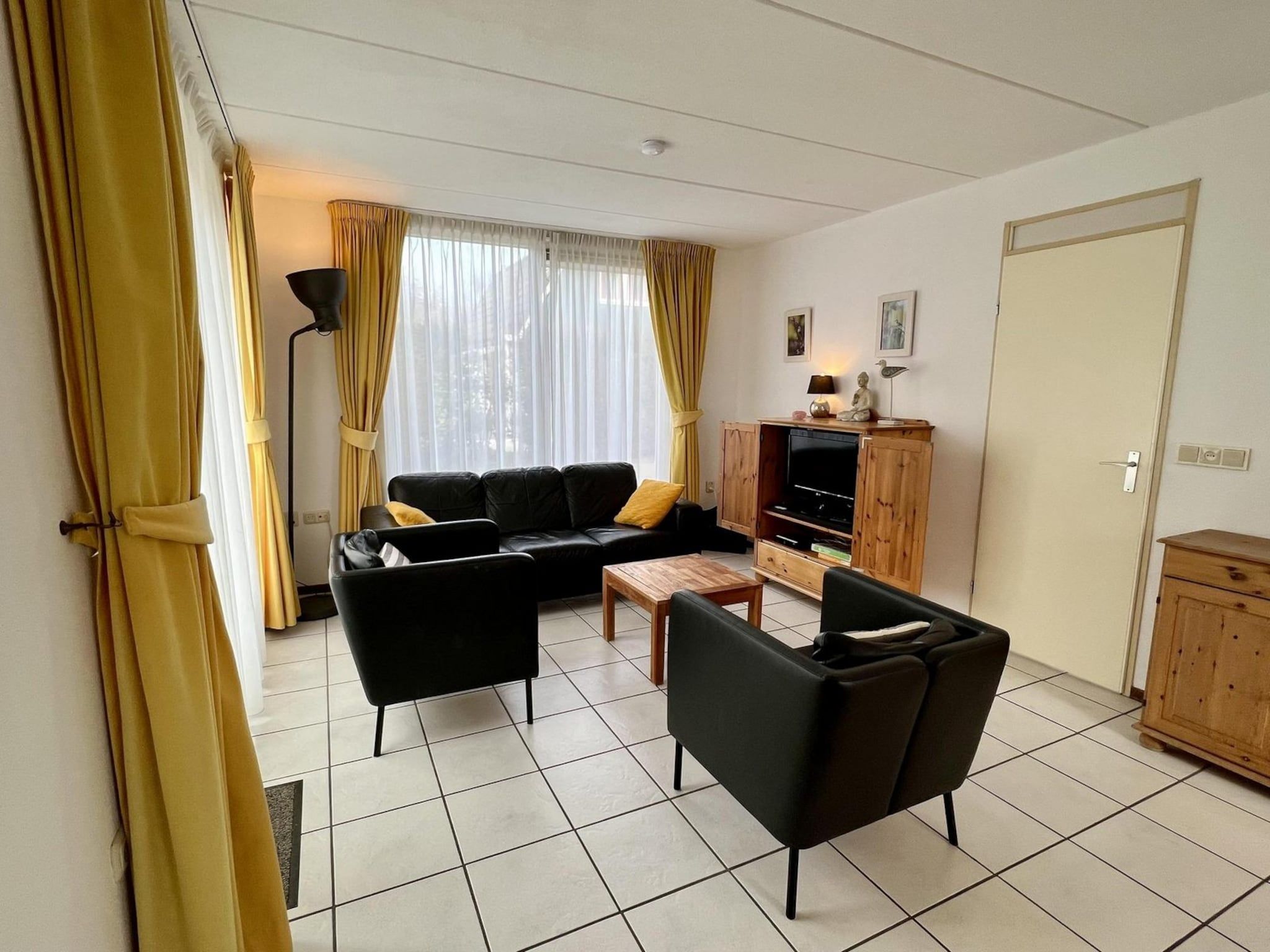 De woonkamer van Campanula 55 in Sint Maartenszee