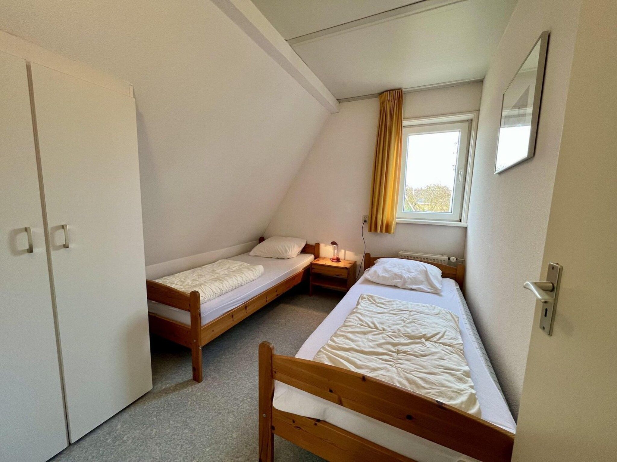 Een slaapkamer van Campanula 55 in Sint Maartenszee
