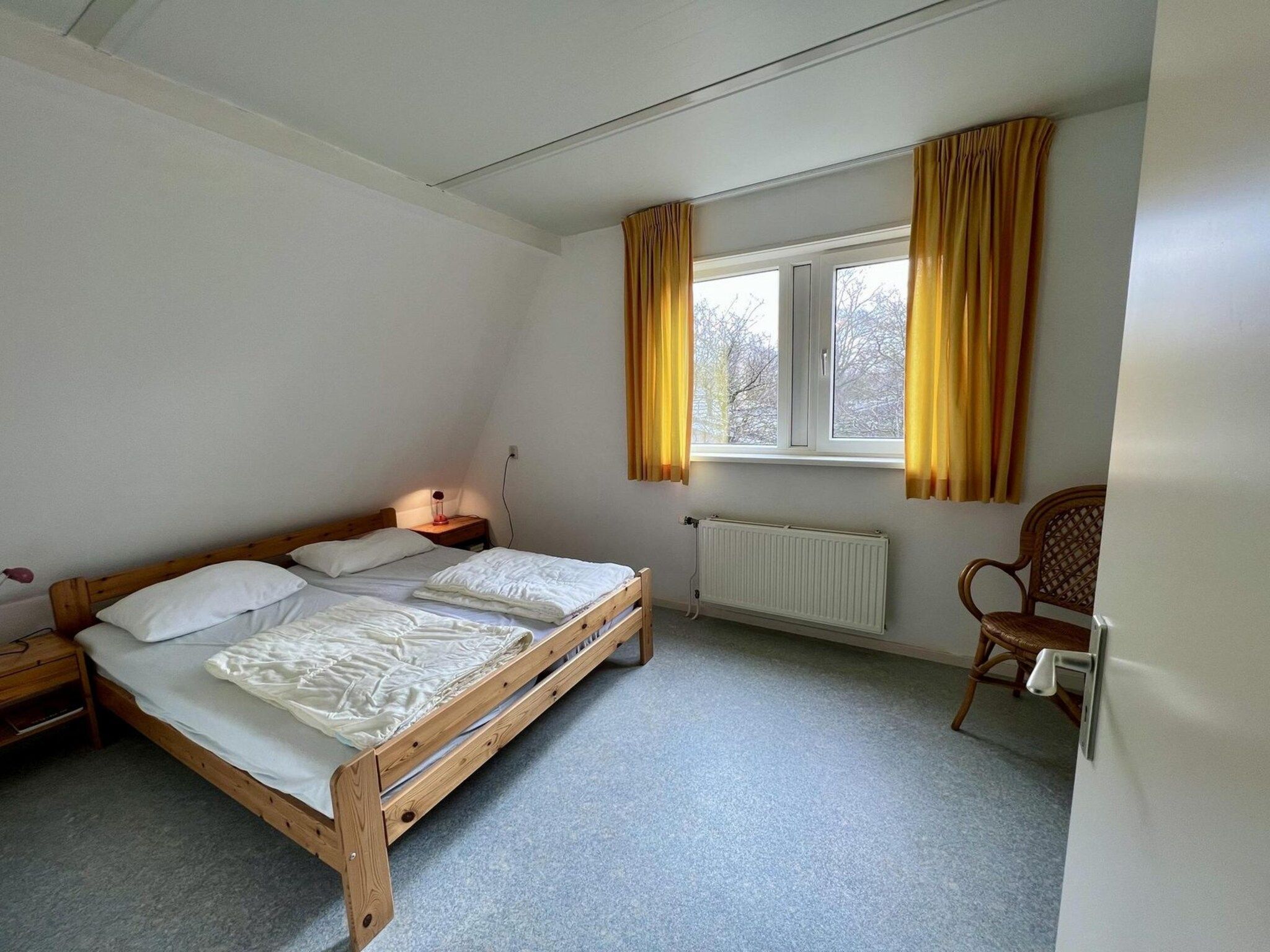 Een slaapkamer van Campanula 55 in Sint Maartenszee