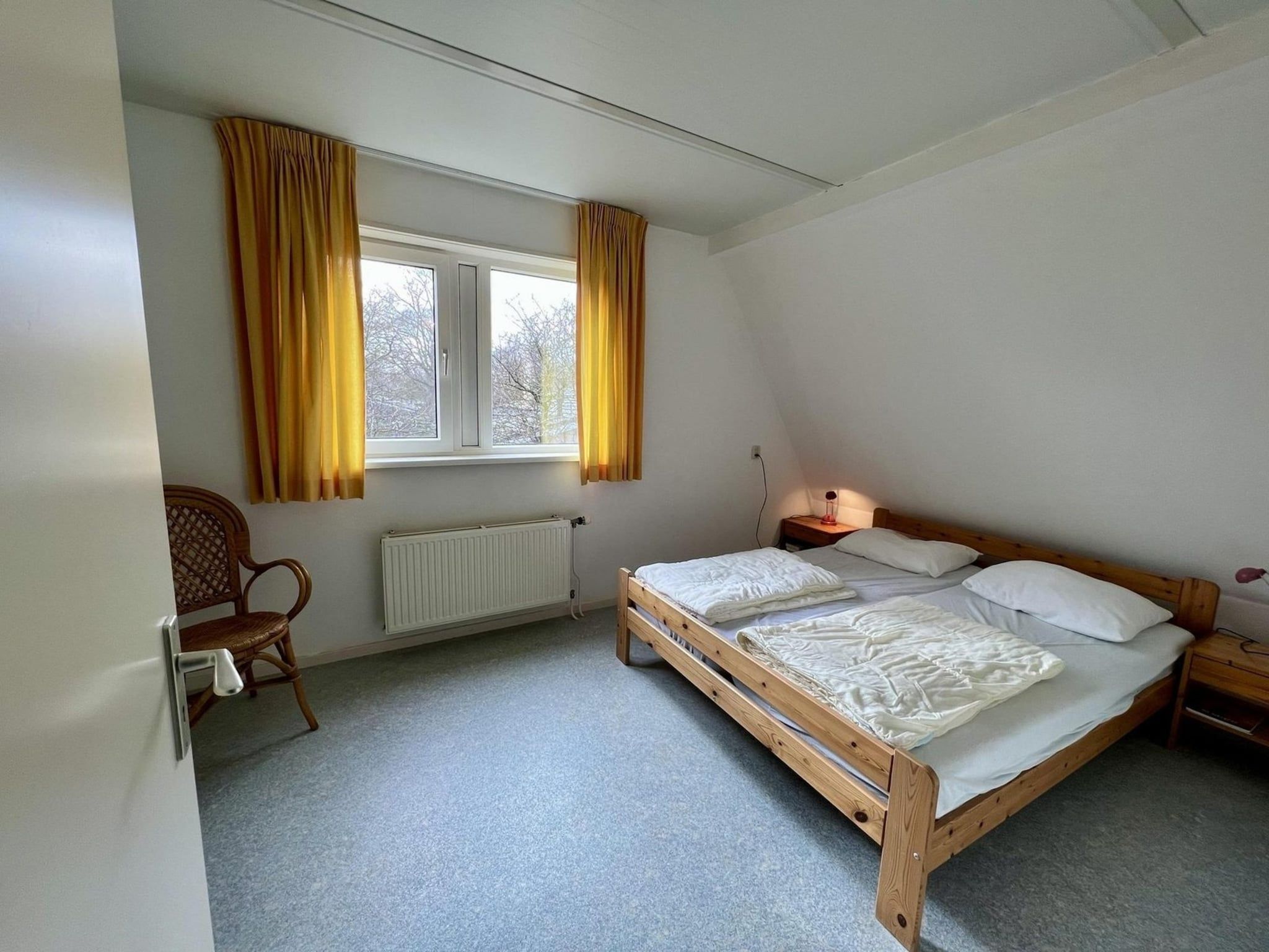 Een slaapkamer van Campanula 55 in Sint Maartenszee