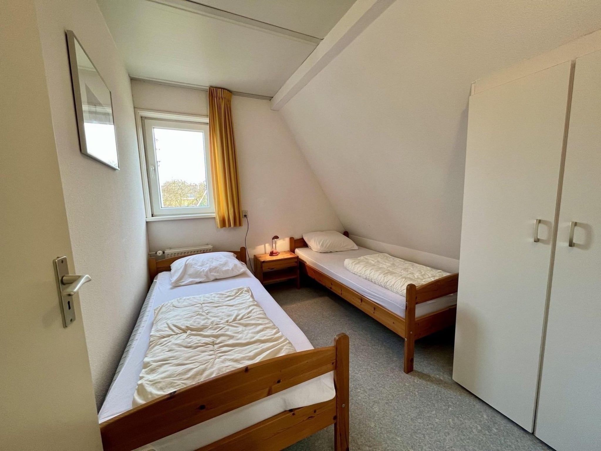 Een slaapkamer van Campanula 55 in Sint Maartenszee