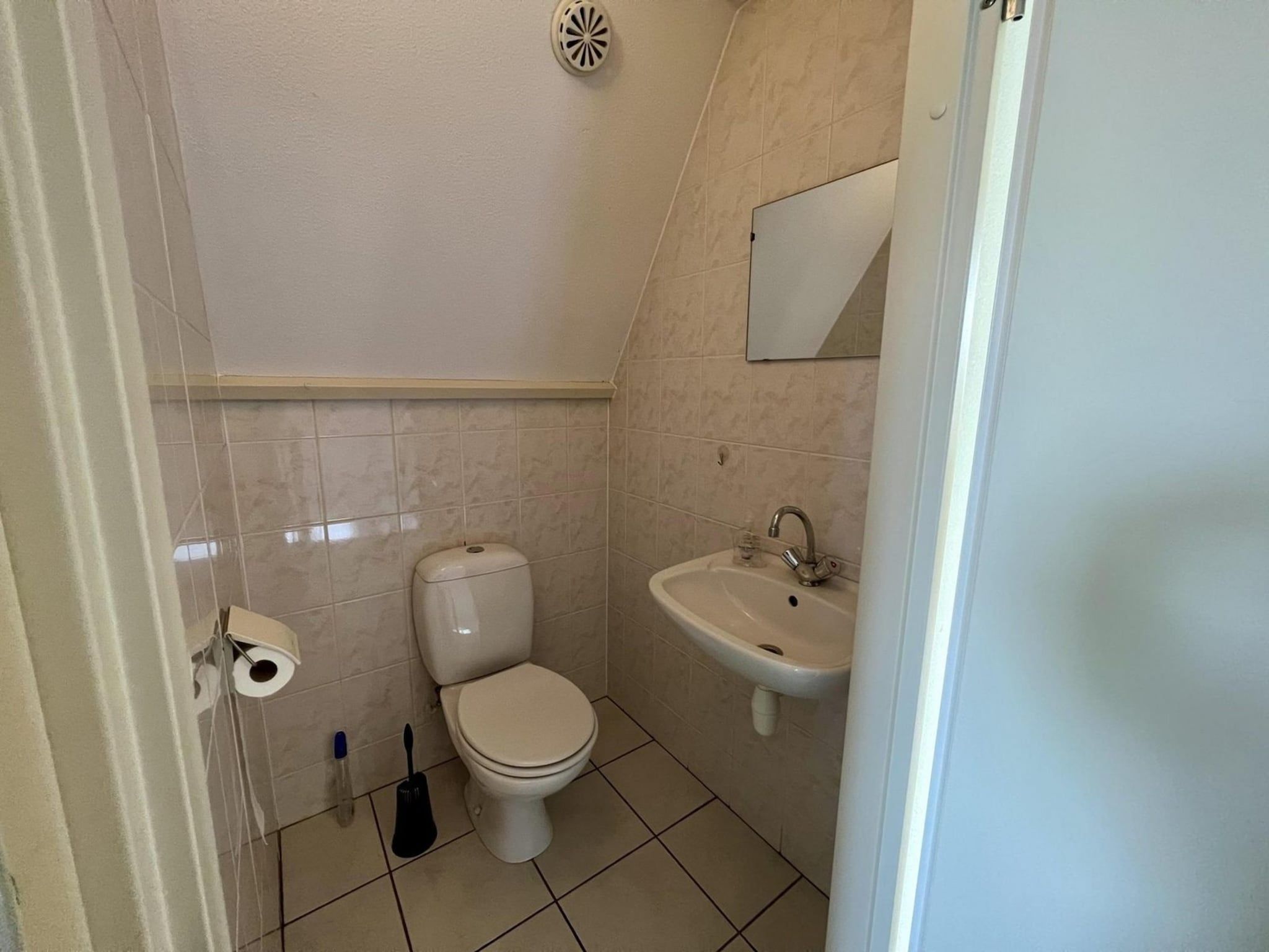 Een slaapkamer van Campanula 55 in Sint Maartenszee