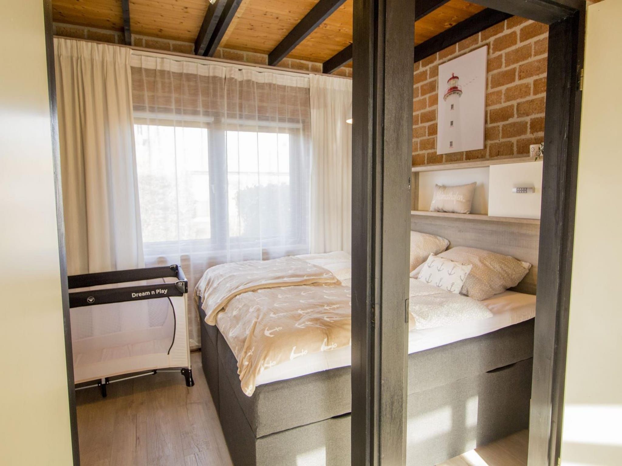 Een slaapkamer van Boerenslag 28 in Sint Maartenszee